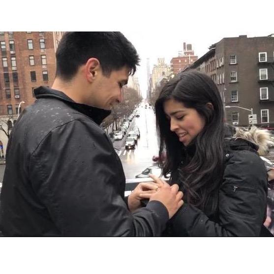 This was taken by a sweet Australian couple. They were secretly taking a video! To Christine's surprise, Ryan nervously tried to unbutton his pocket, got down on one knee, and popped the question!