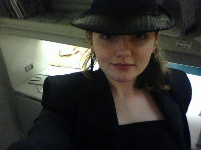 Julia trying to be cool in a fedora. In hindsight, she succeeded.