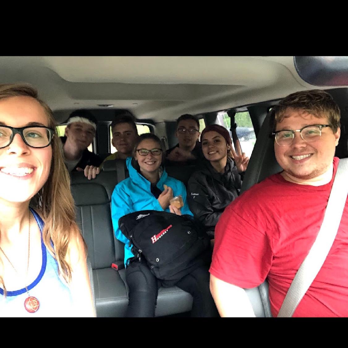 Our first ever picture together when we met rock climbing at Otter Cliffs in Maine (circa August 2018). 

Brooke is front middle with the blue jacket and Anthony is the back far right.