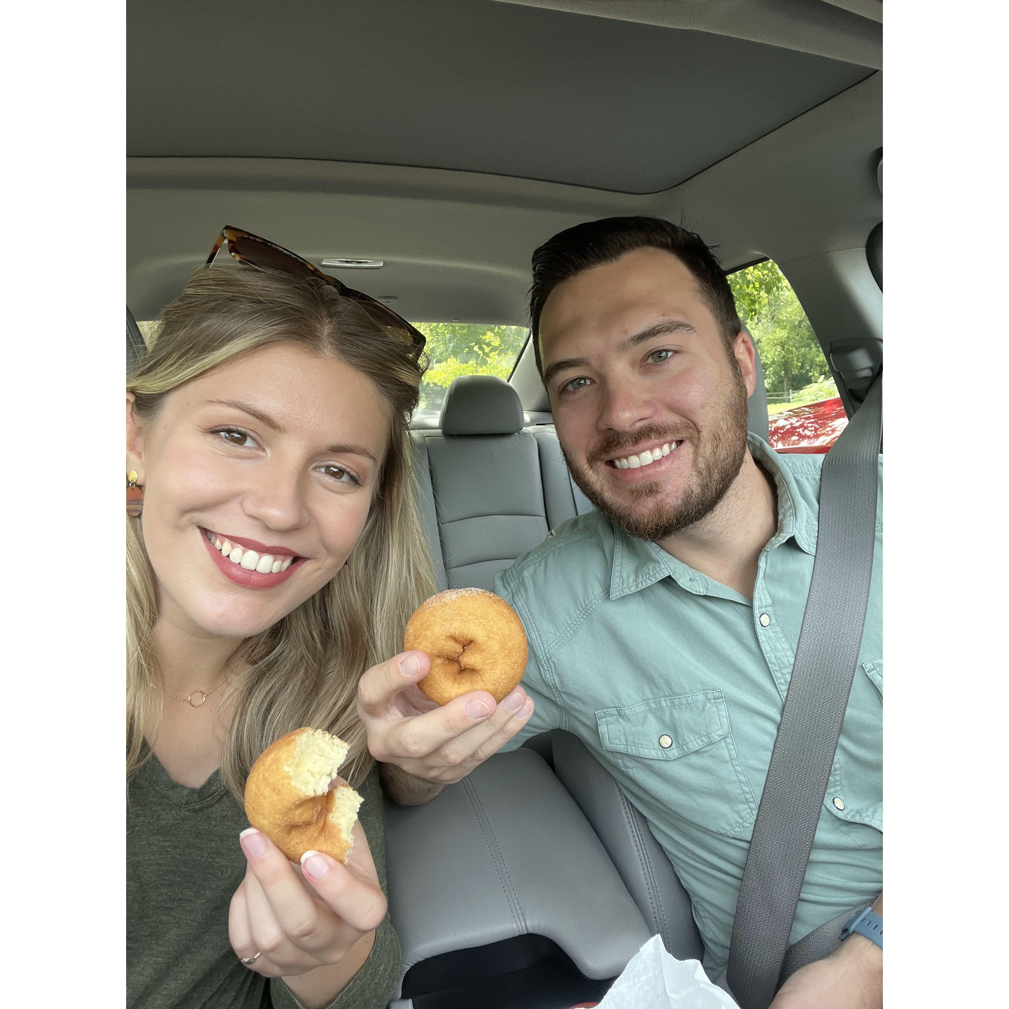 Enjoying our favorite donuts from Franklin's Cider Mill! The bees wanted them, too, so we took shelter in the car.