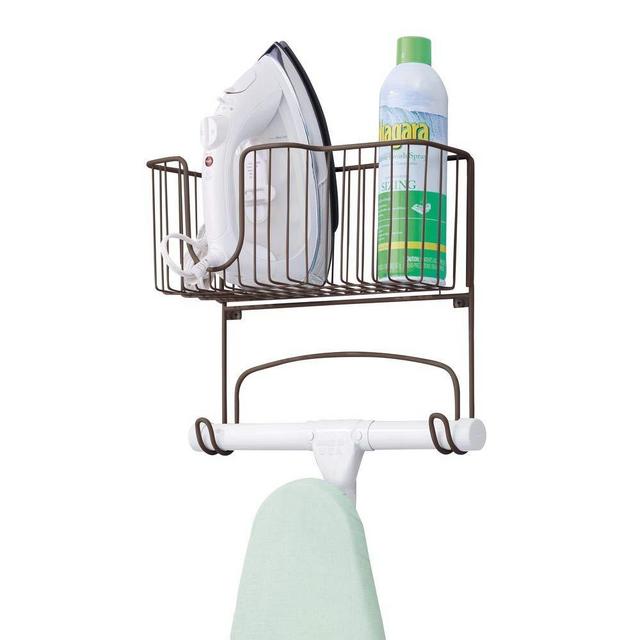 mDesign Metal Wall Mount Ironing Board Holder with Large Storage Basket - Holds Iron, Board, Spray Bottles, Starch, Fabric Refresher for Laundry Rooms - Bronze