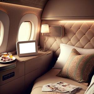 Upgrade Sarah's flight to First Class
