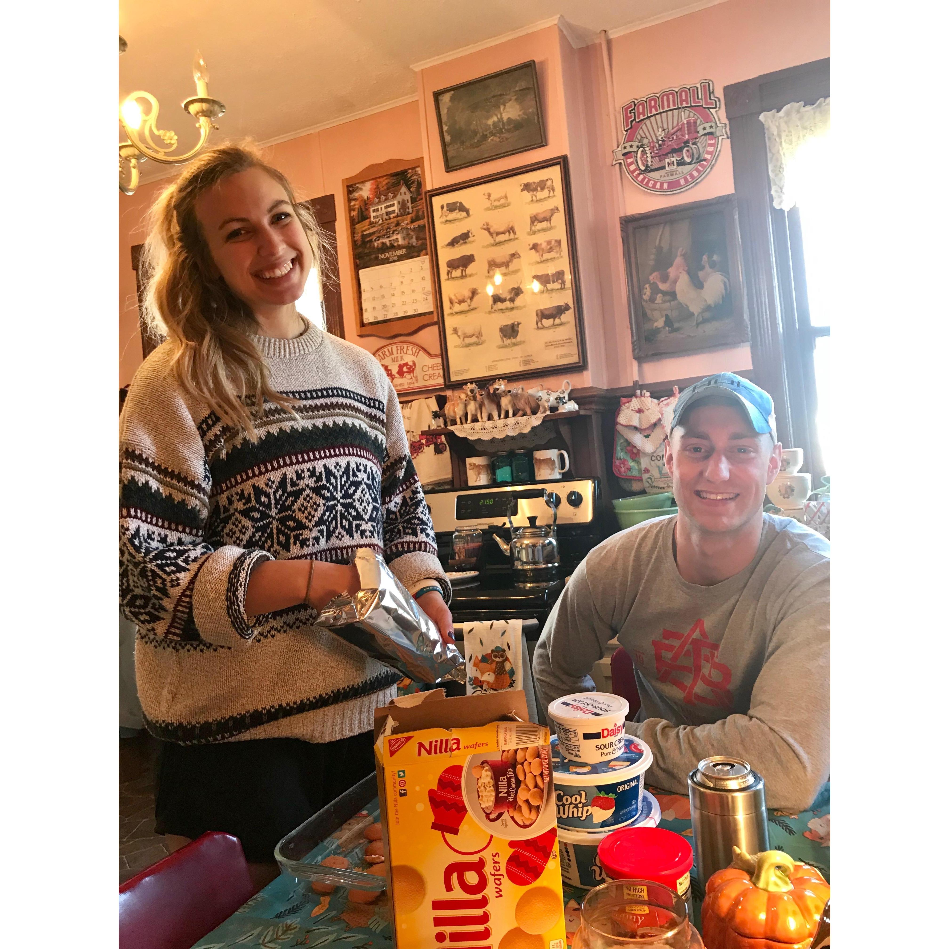 Hunter "helping" Emily bake for Thanksgiving.