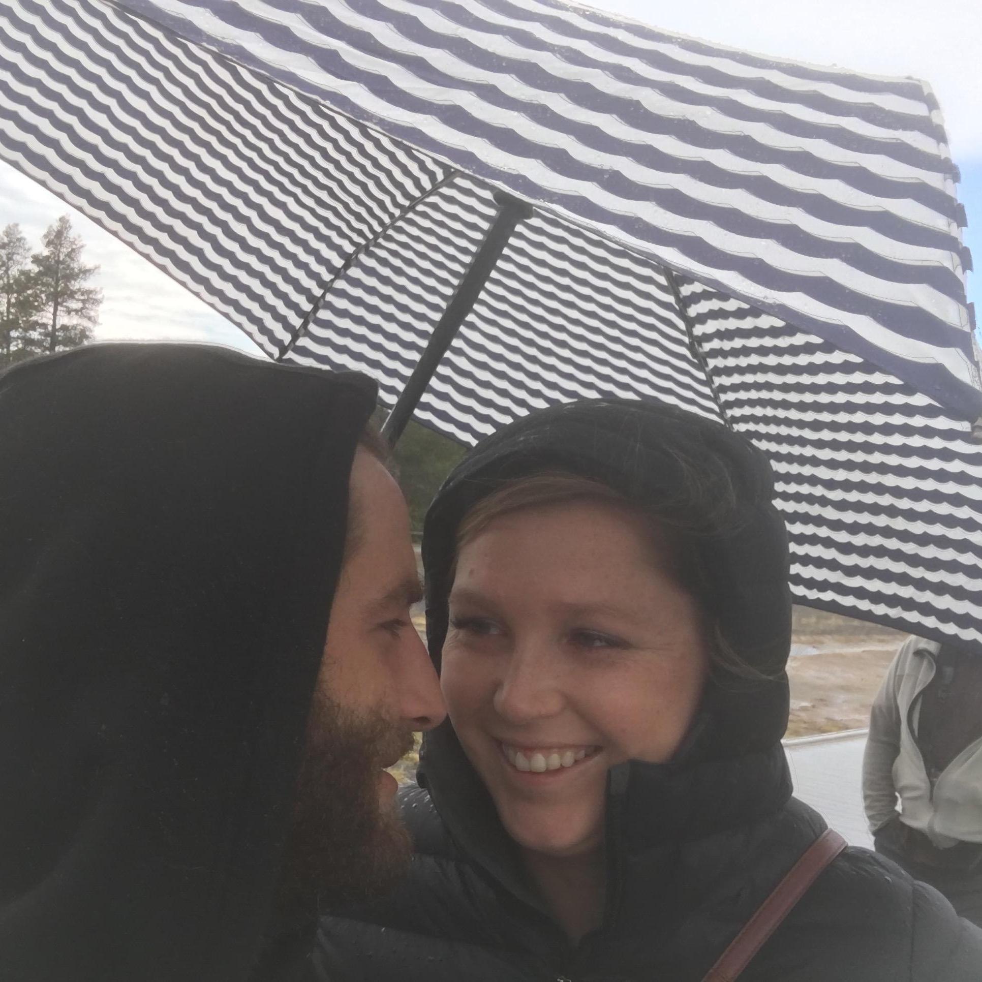 Rain or shine, we always have fun in Yellowstone! Here we are on the boardwalk at Old Faithful.