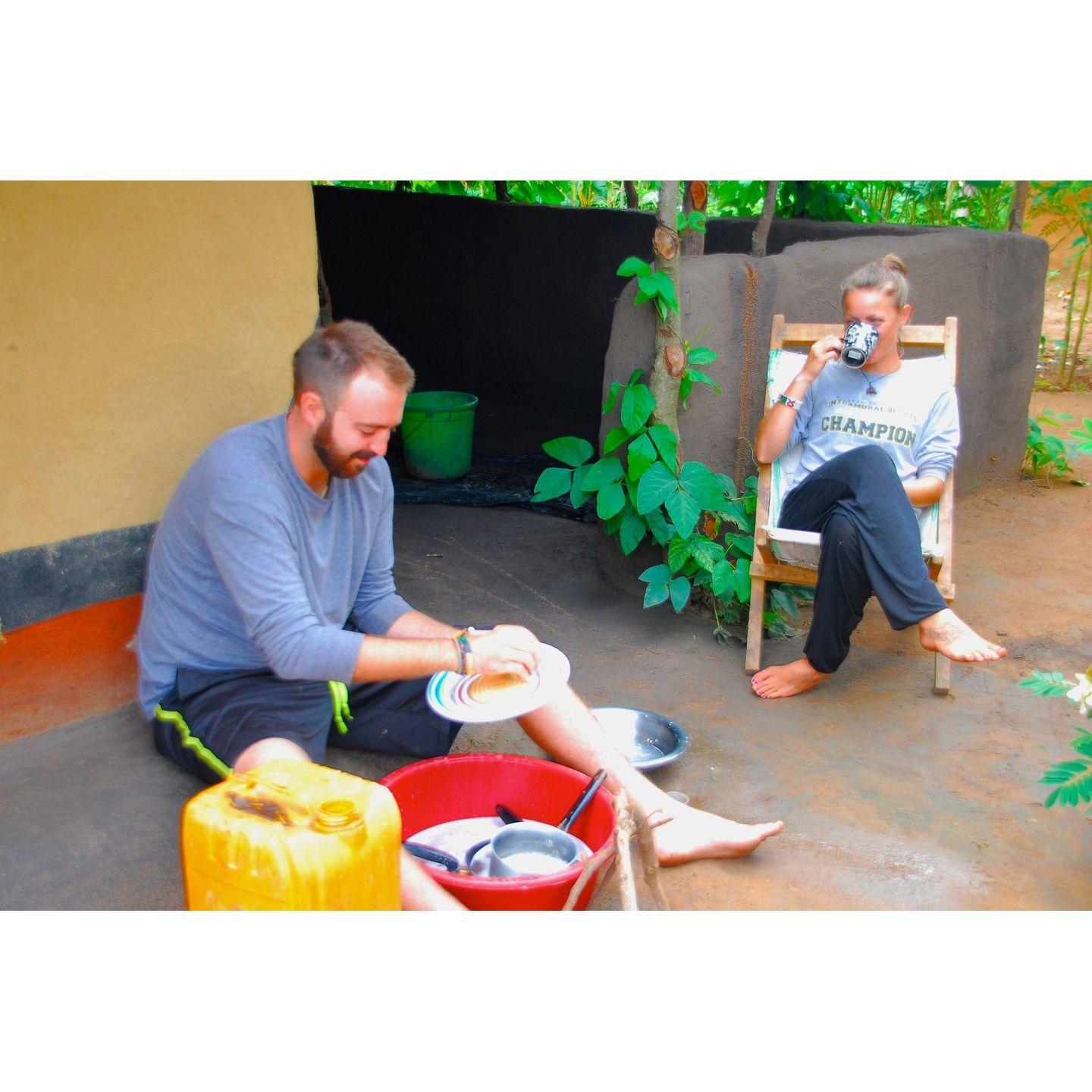Switching gender roles outside my hut in Lundazi, Zambia, Africa (2013)