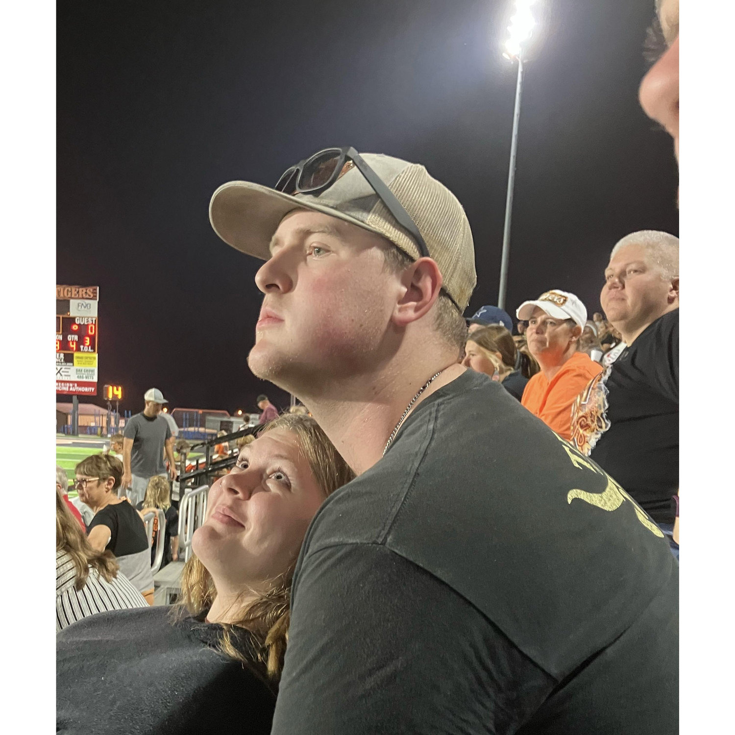 Watching our first high school football game together