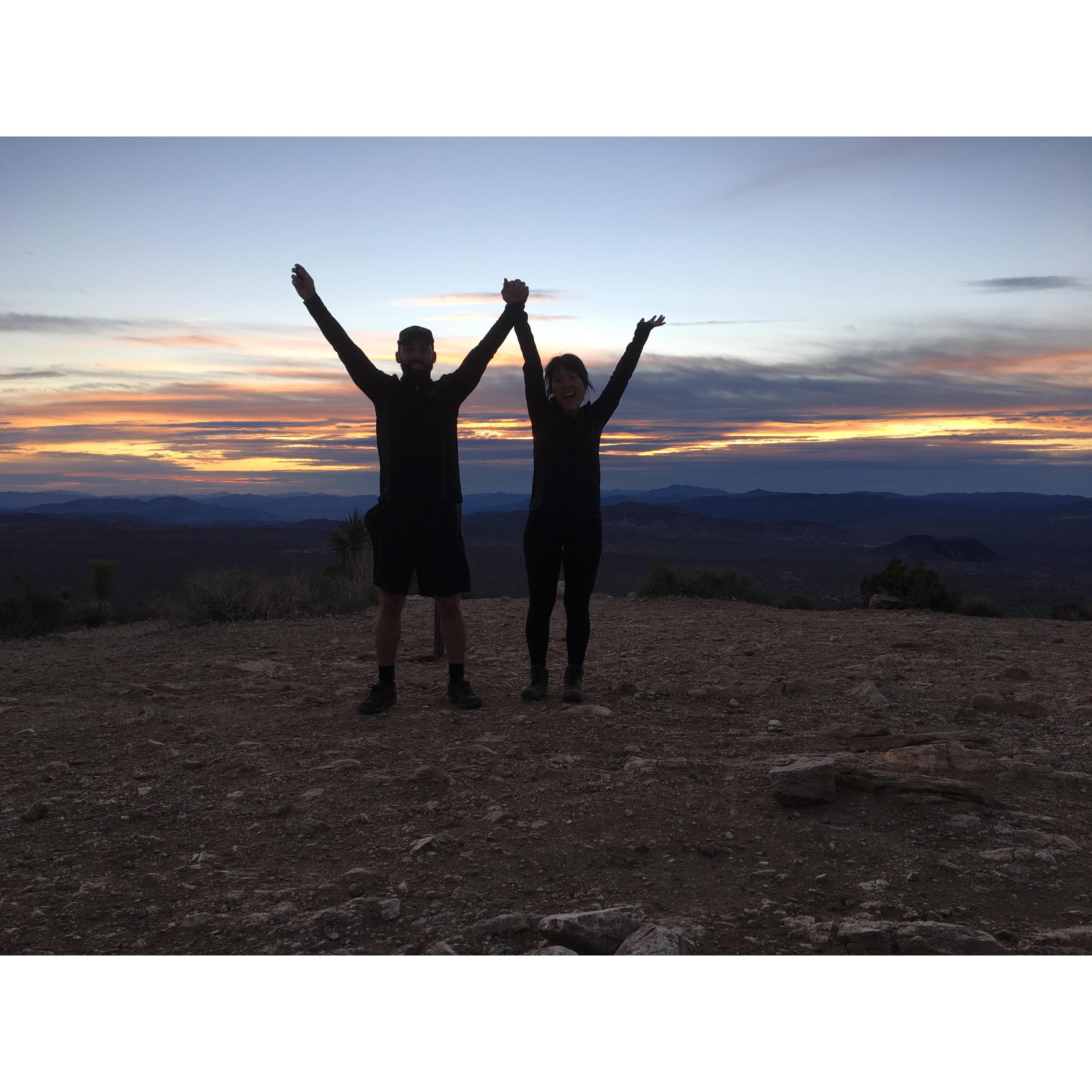 Ryan proposes on top of Ryan Mountain in Joshua Tree. We ran up the mountain to catch the sunrise so good thing this picture is dark because we were TOIRED.
