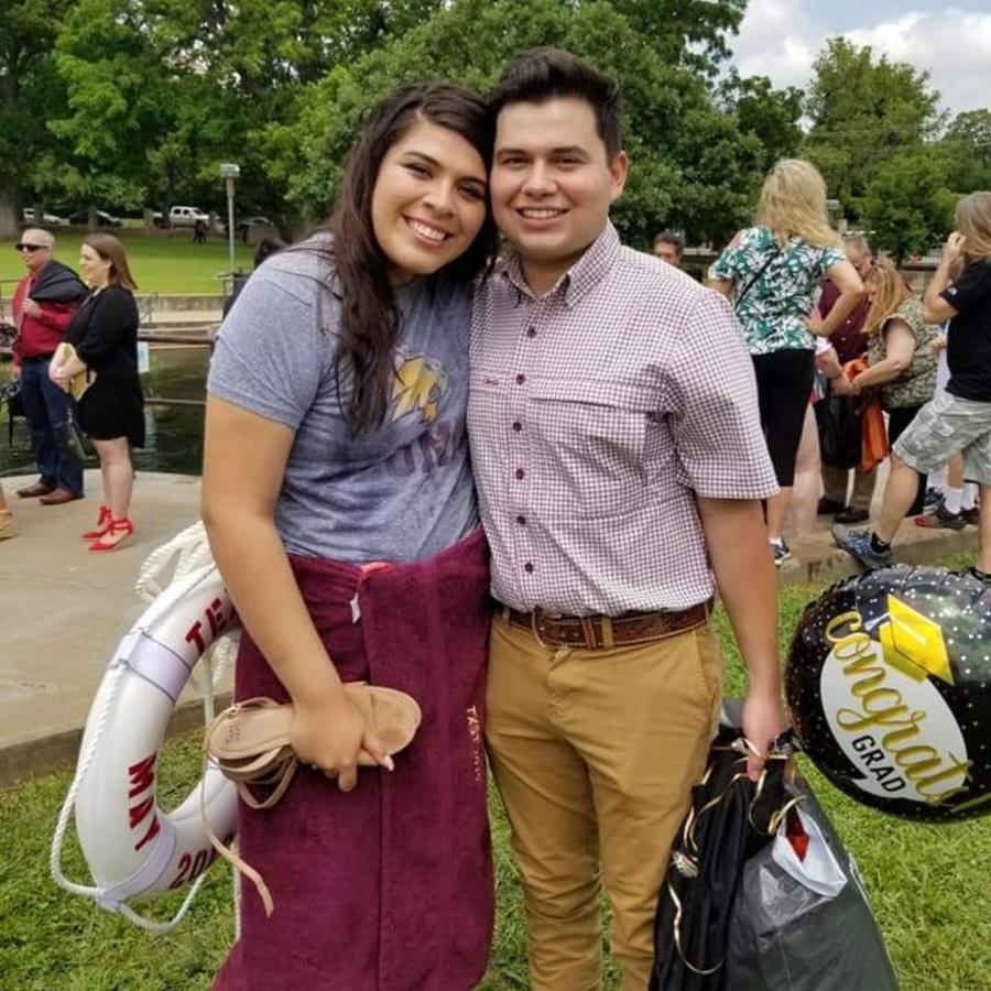 Moments after the grad got saved with a real life preserver.