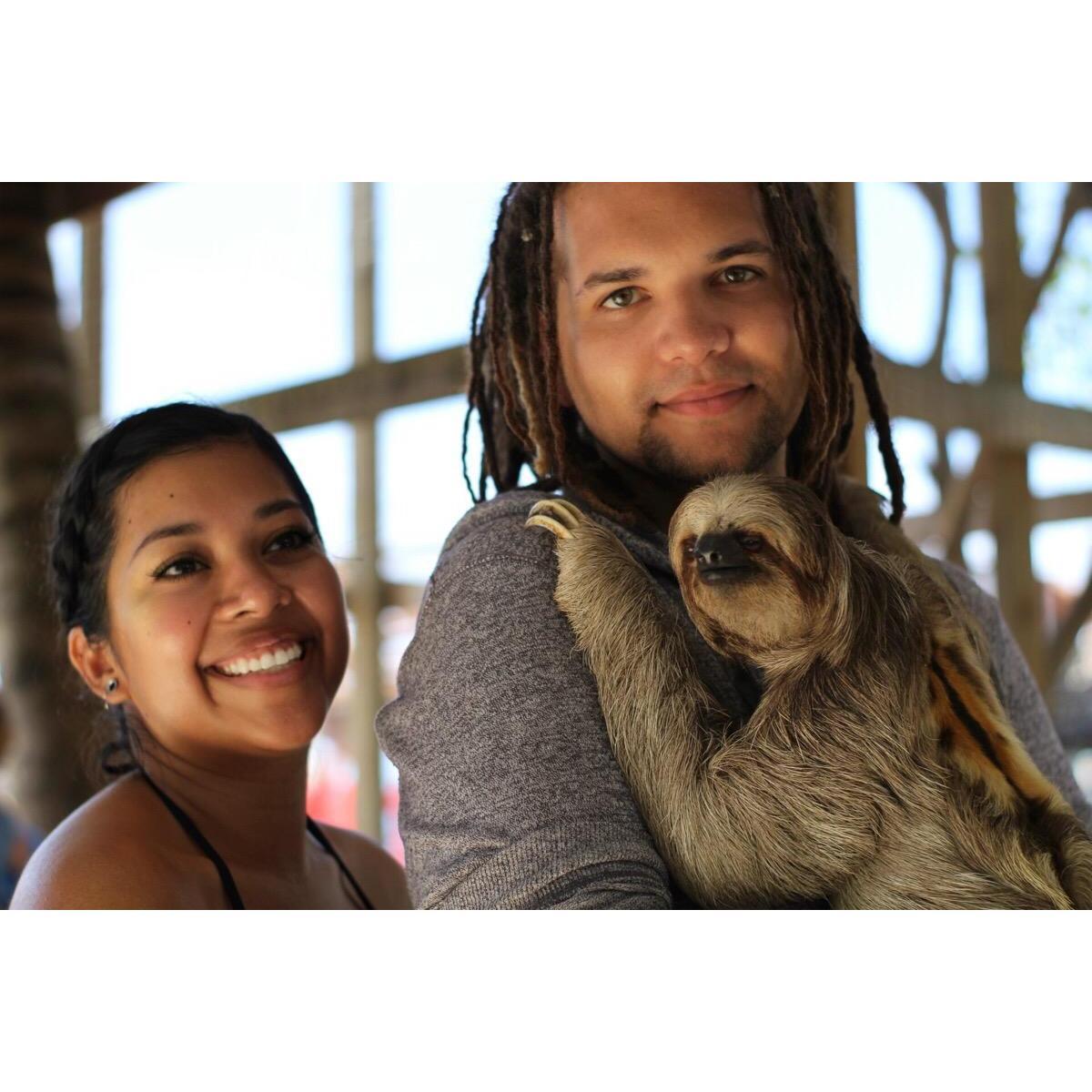 Holding a sloth on our cruise!