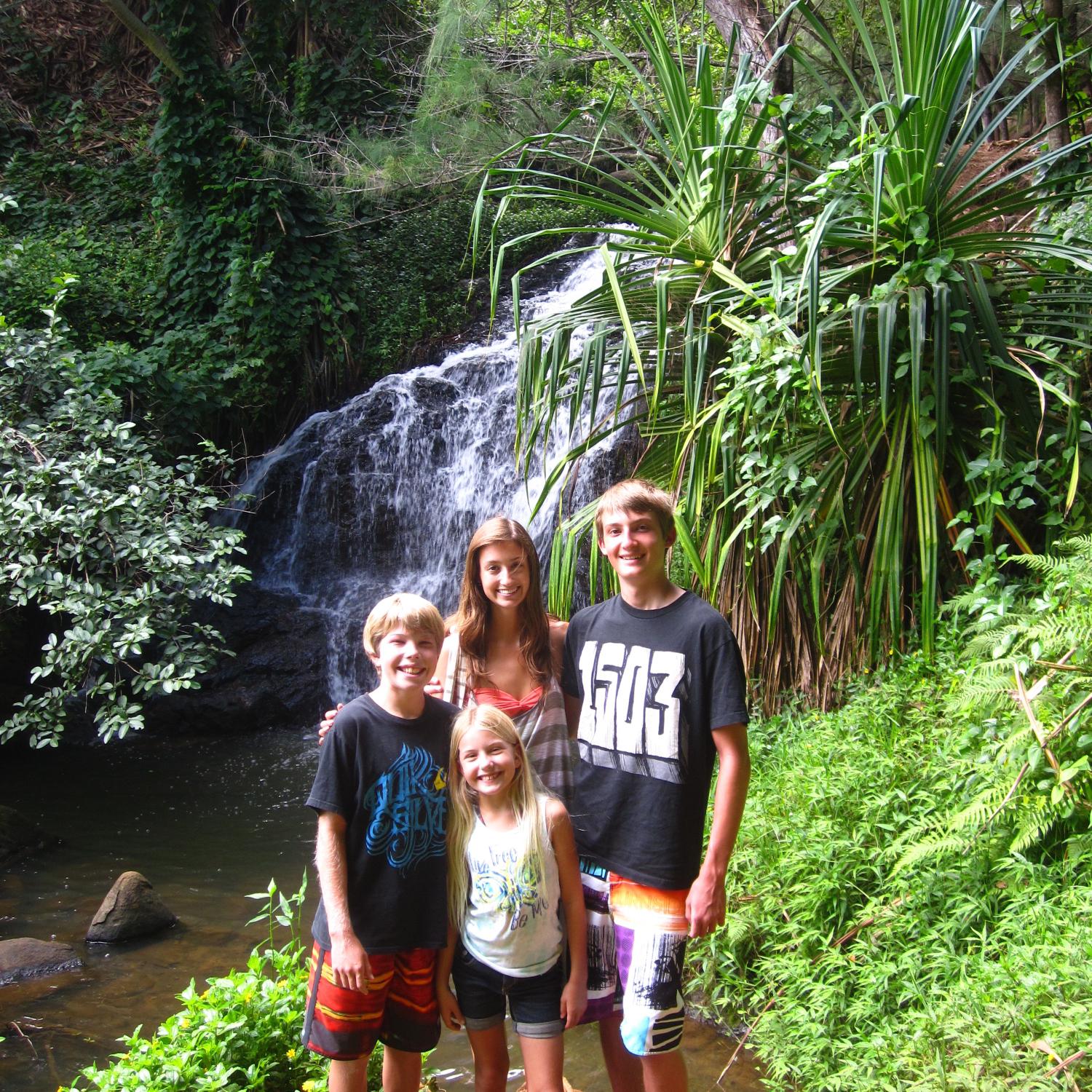 Julie, her brother Eric, and her cousins Jackson and Sydney on a hike to Queen’s Bath in 2011.