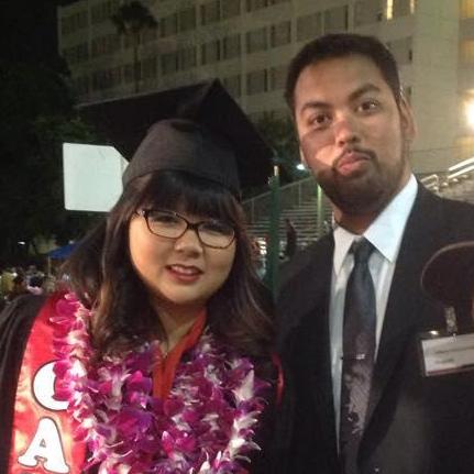 He worked grad pictures as she graduated.
