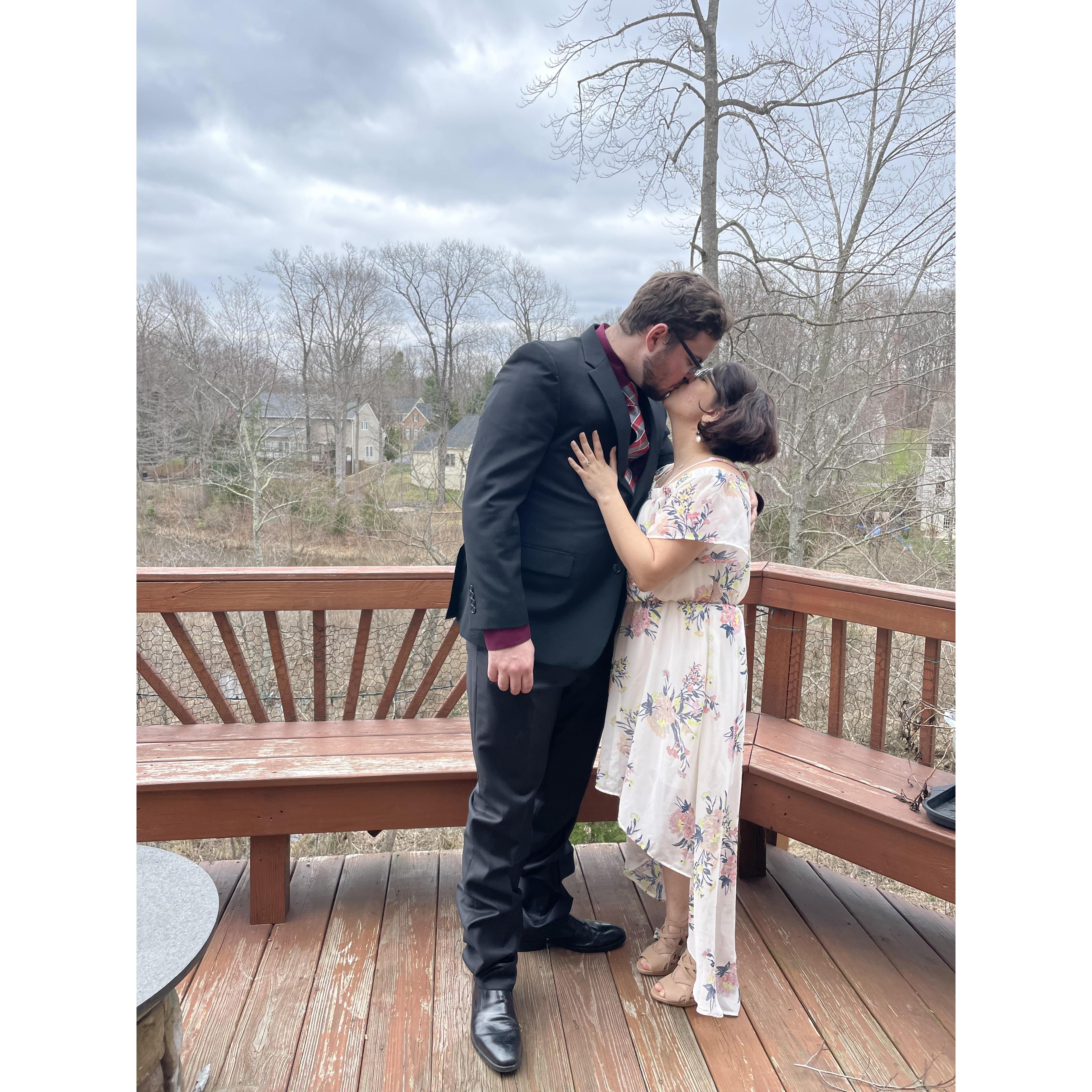 This is one of our engagement photos. We had it taken on our deck that overlooks a pond. It was really windy that day.