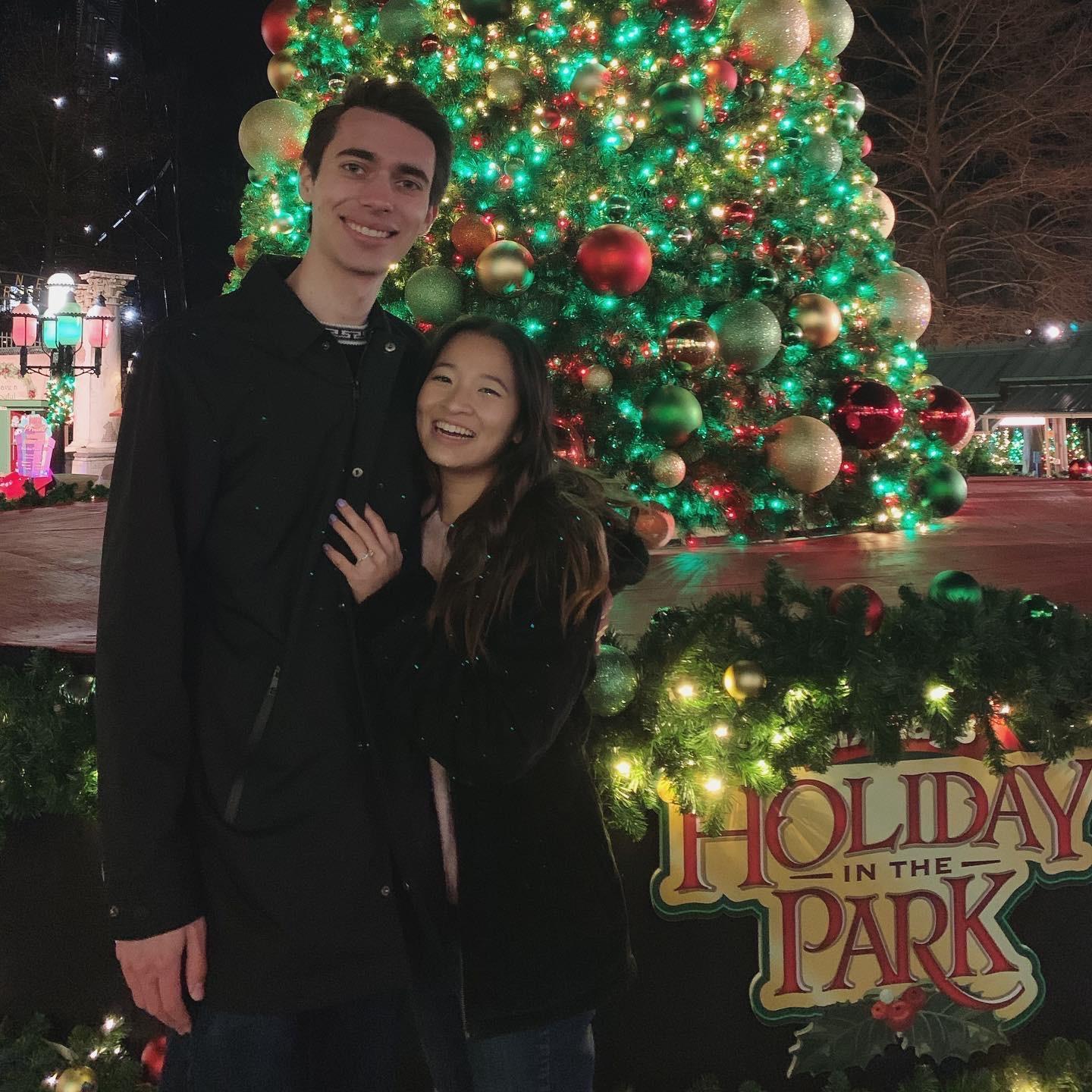 5/20/20 - Our annual picture by a Christmas tree at Six Flags,. This time within a couple hours of getting engaged!