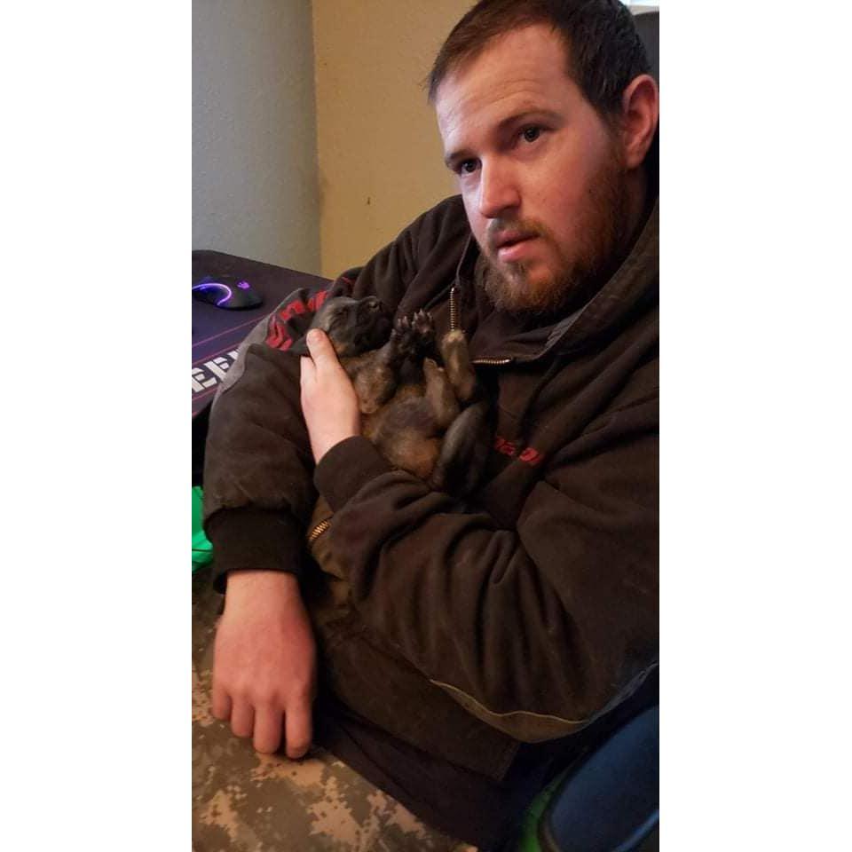 Daniel with one of Our dogs puppies