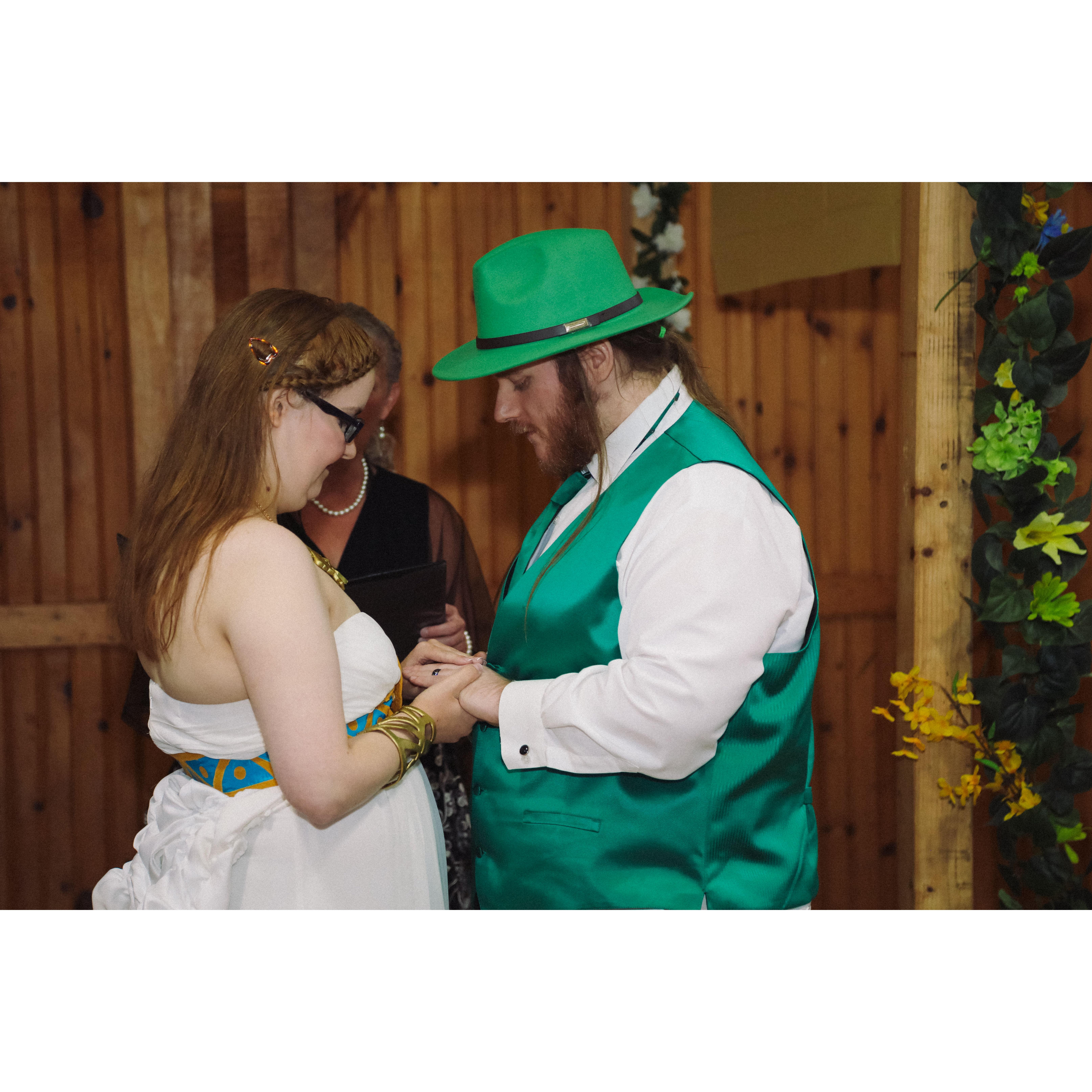 during the ceremony, Sara and Herb putting the rings