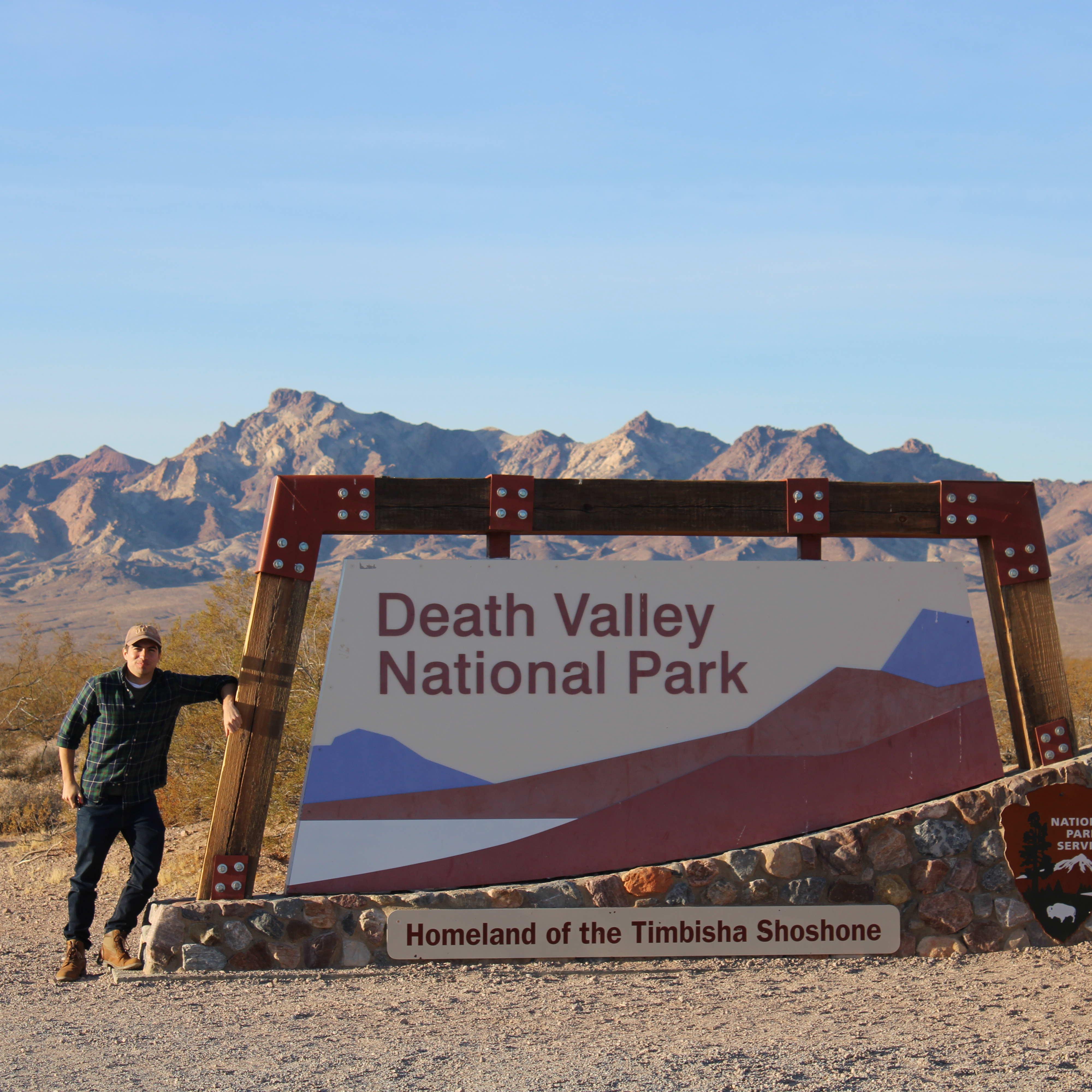 Our First Roadtrip Together, We chose to take separate pictures by the park sign because no one else was there to take a picture for us. haha