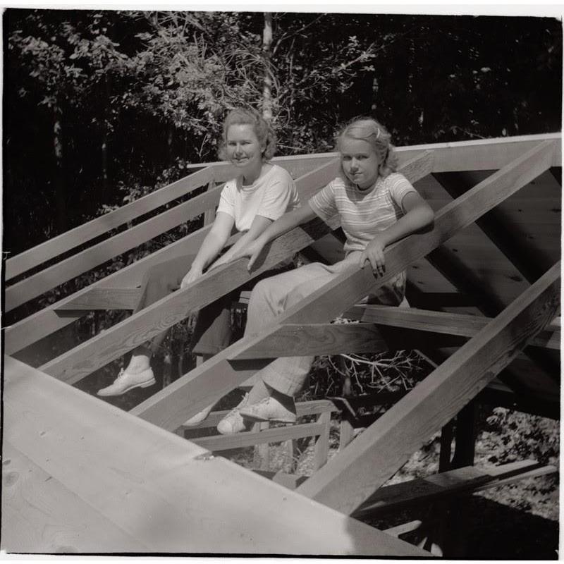 Gertrude and Vonie in the rafters of the cabin around 1941.