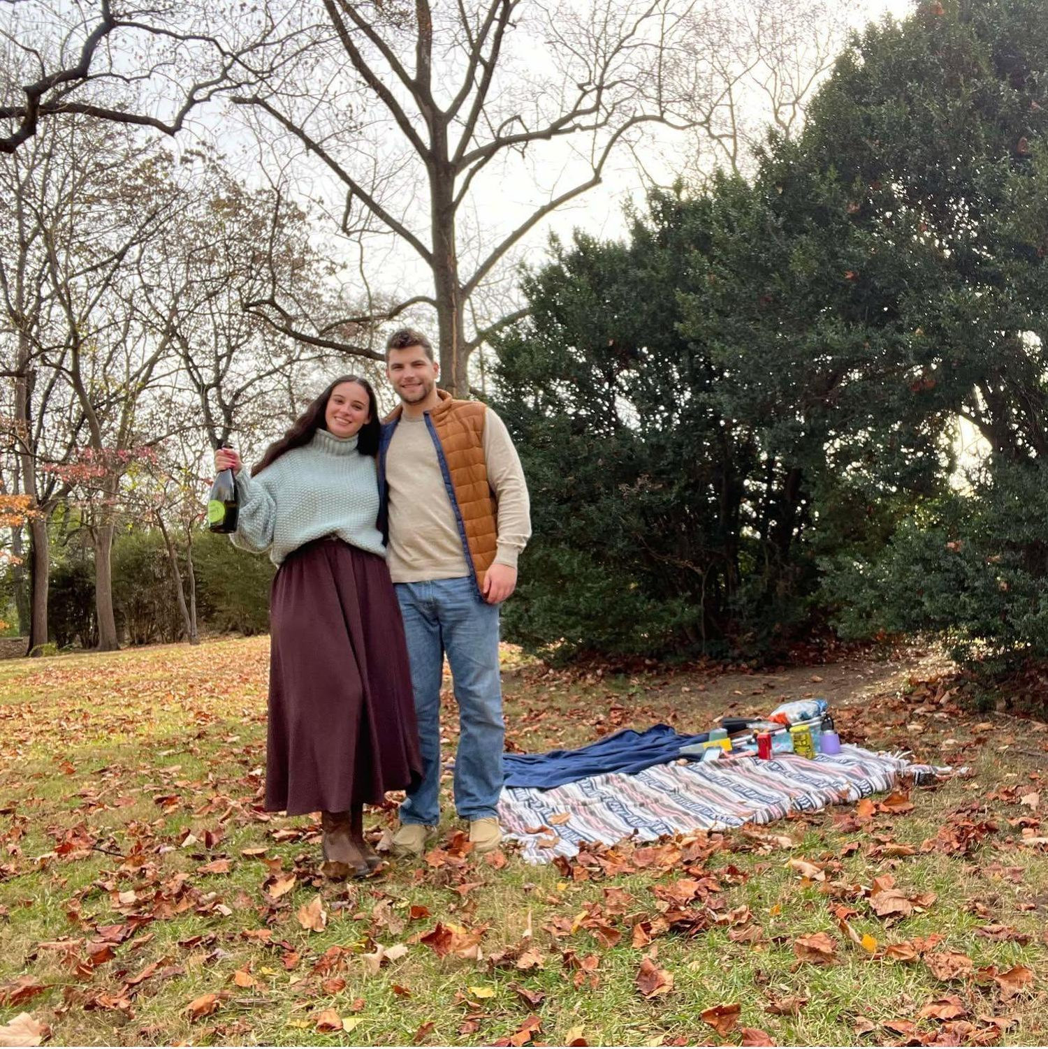 Standing in the exact spot we got engaged. A picnic was what we did for our second date in April 2023.