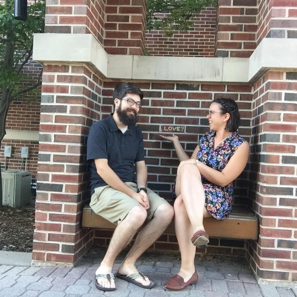 Jen and Alec worked a summer music program together for many years, and stayed at St. Norbert College. This bench still says LOVE? and Jen knew she wanted to marry Alec when they took this picture.