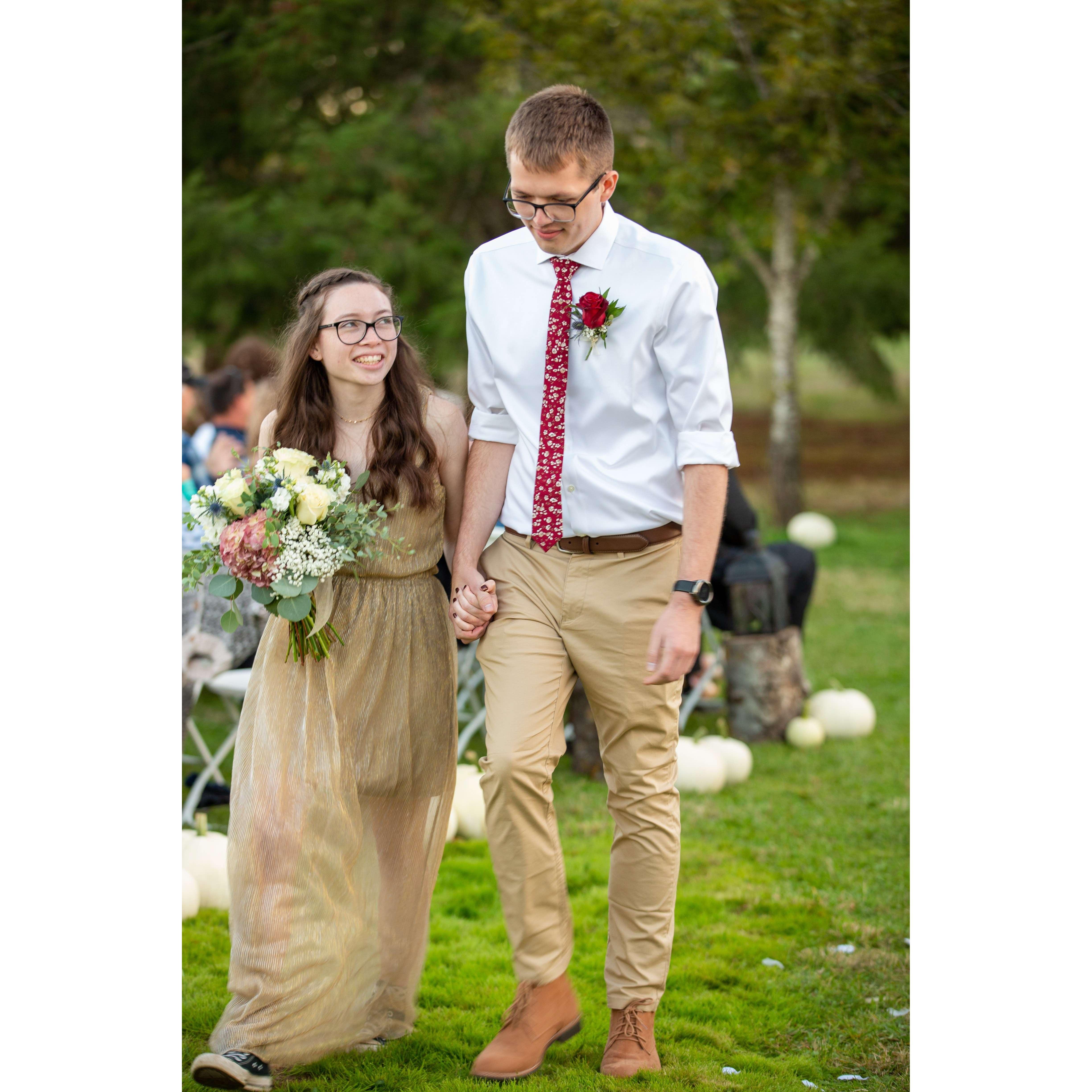 Kiara and Garret at Garret's sister's wedding in October of 2021