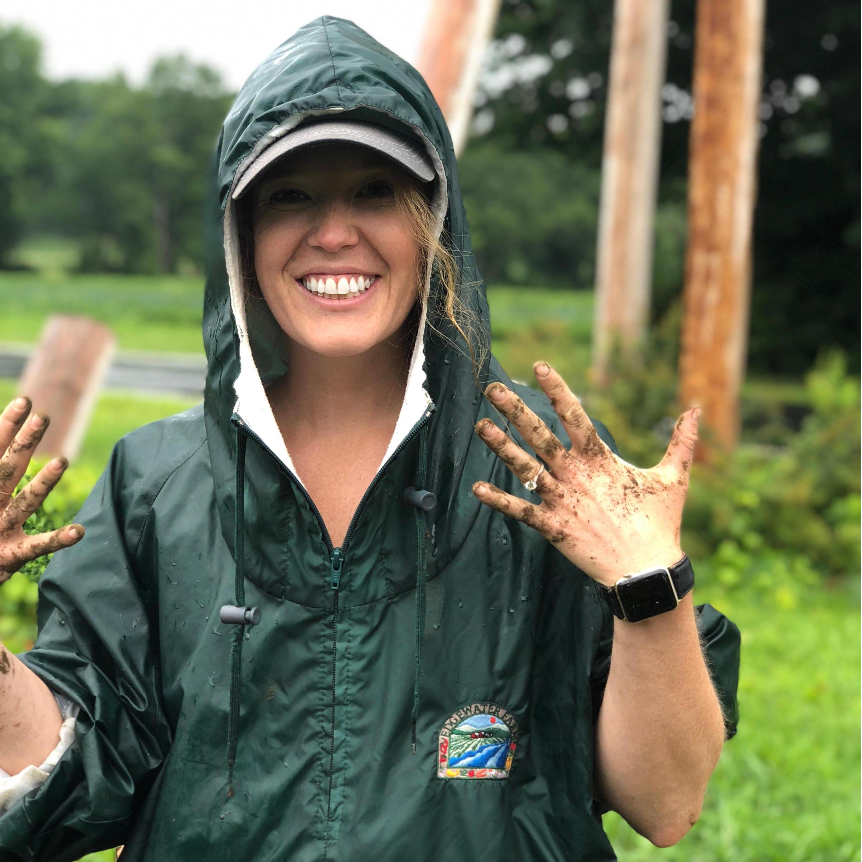 Lauren digging for potatoes with new bling at Edgewater Farms (where we got engaged!)