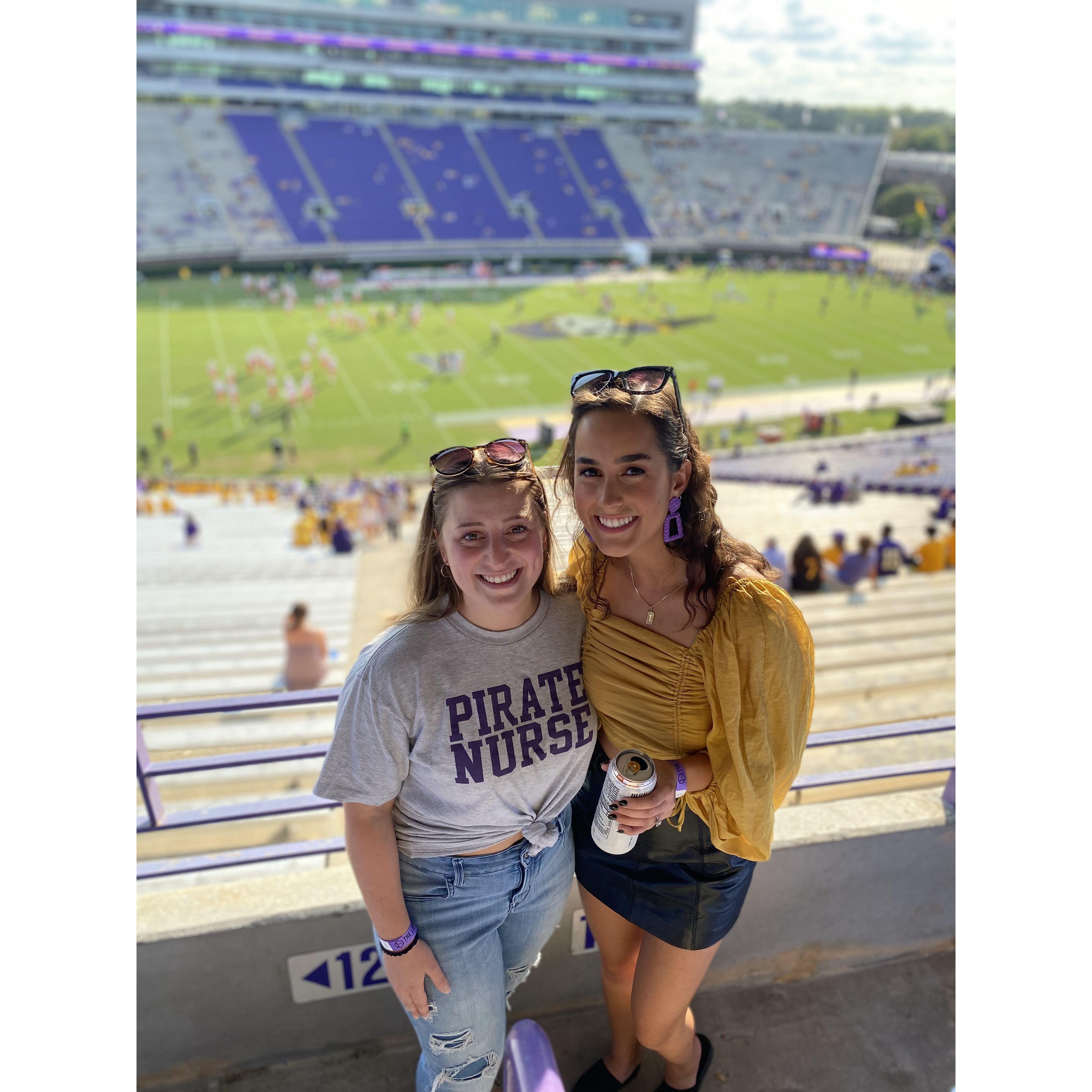 Adrie and Jordan pretending to be fans of ECU for a split second.