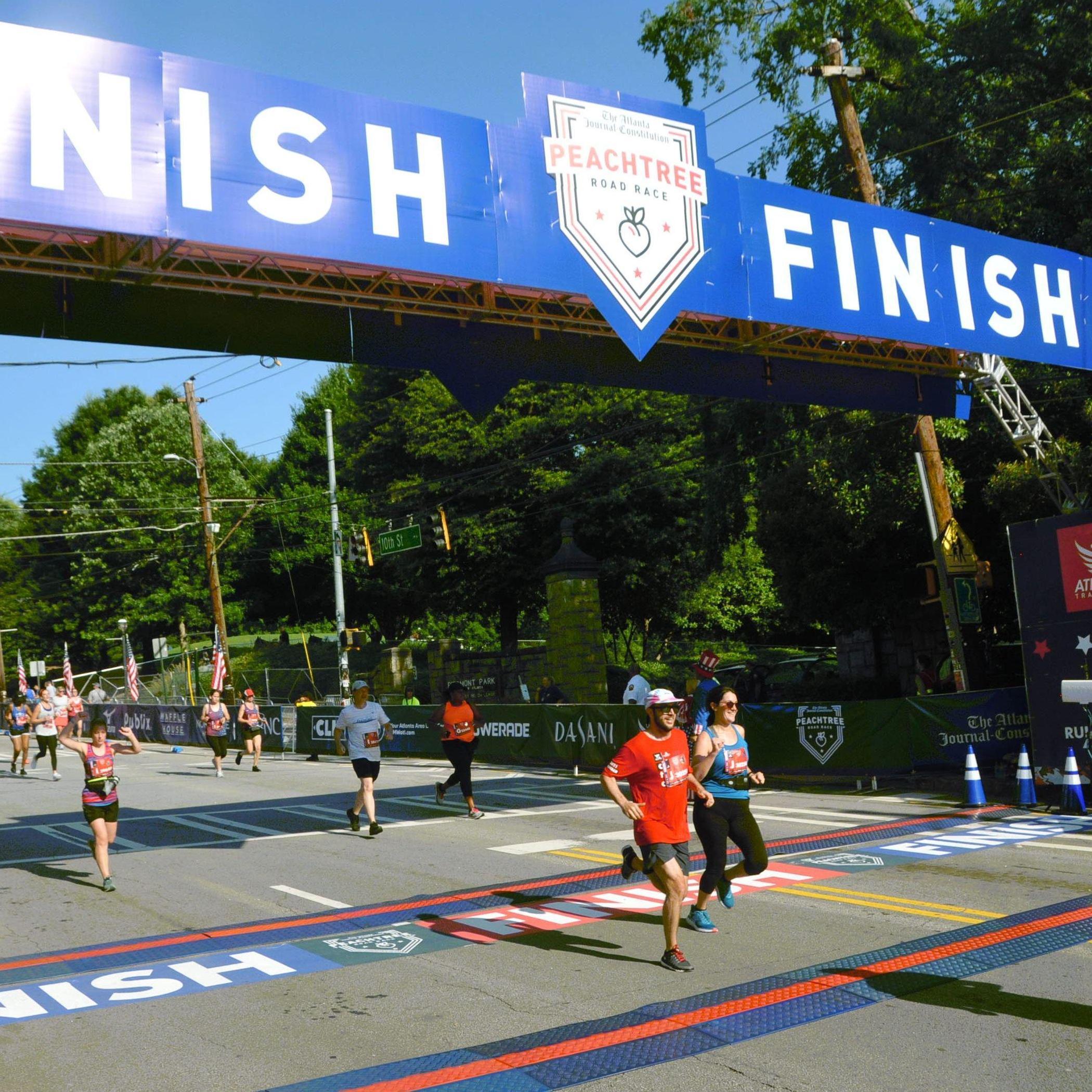 Crossing the finish line at our first Peachtree Road Race
