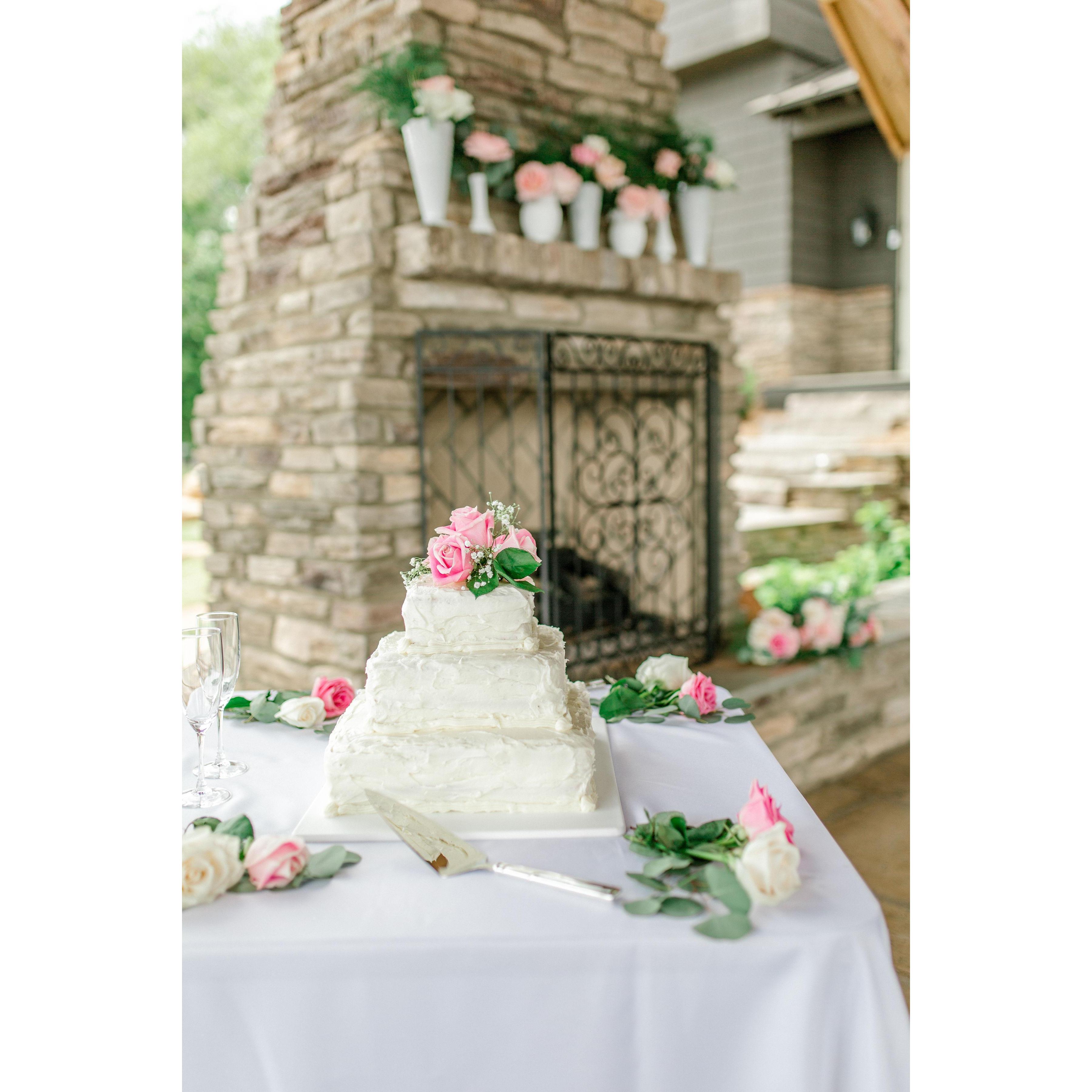 Our delicious strawberry cake was baked and decorated by Mark's mom, Lynne Madison. The milk glass vases on the mantle were provided by Mariana's grandmother, Linda Walker.