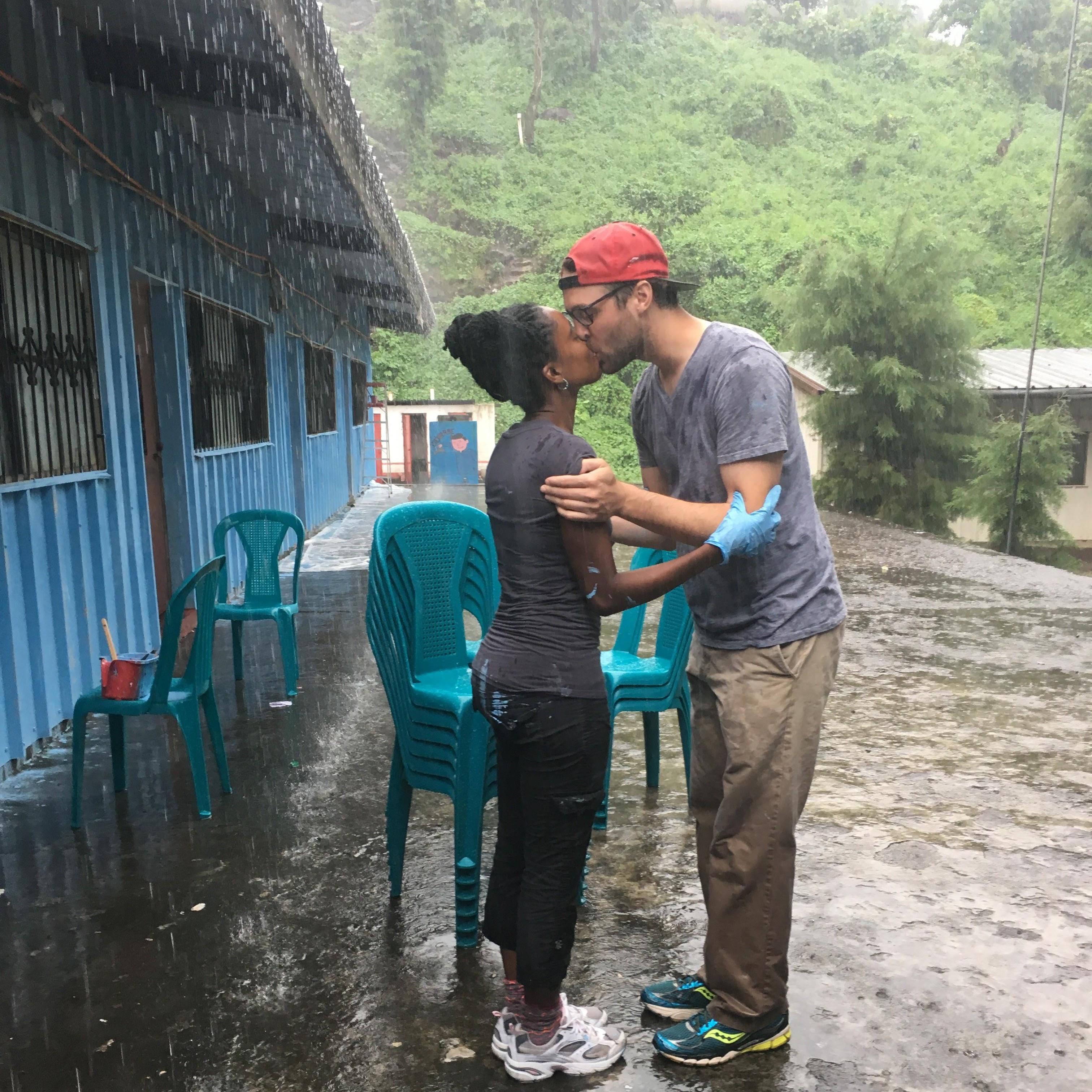 Guatemala: Kisses in the pouring rain...in SanLucas, Toliman in Guatemala.... not pictured are the curios peering eyes of little children, residents of the village whose school we had painted...#love
