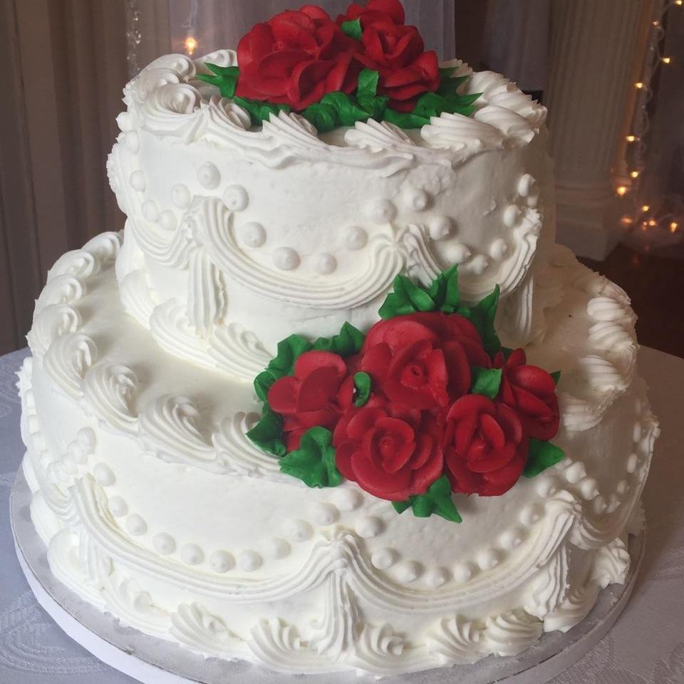 The cake only with purple flowers.