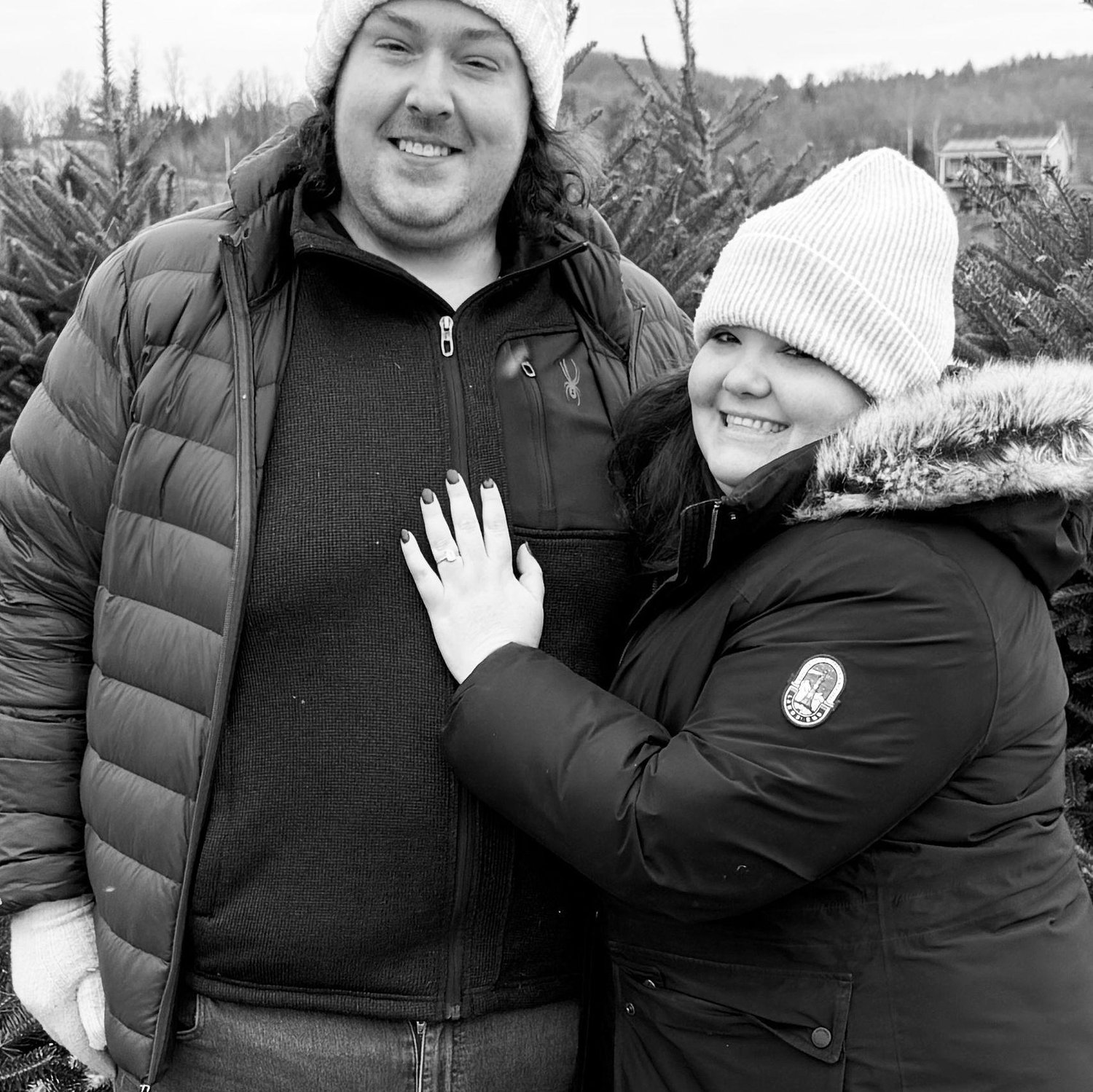 Often forgetting to take photos, our friends snapped this engagement photo while cutting down our Christmas tree.