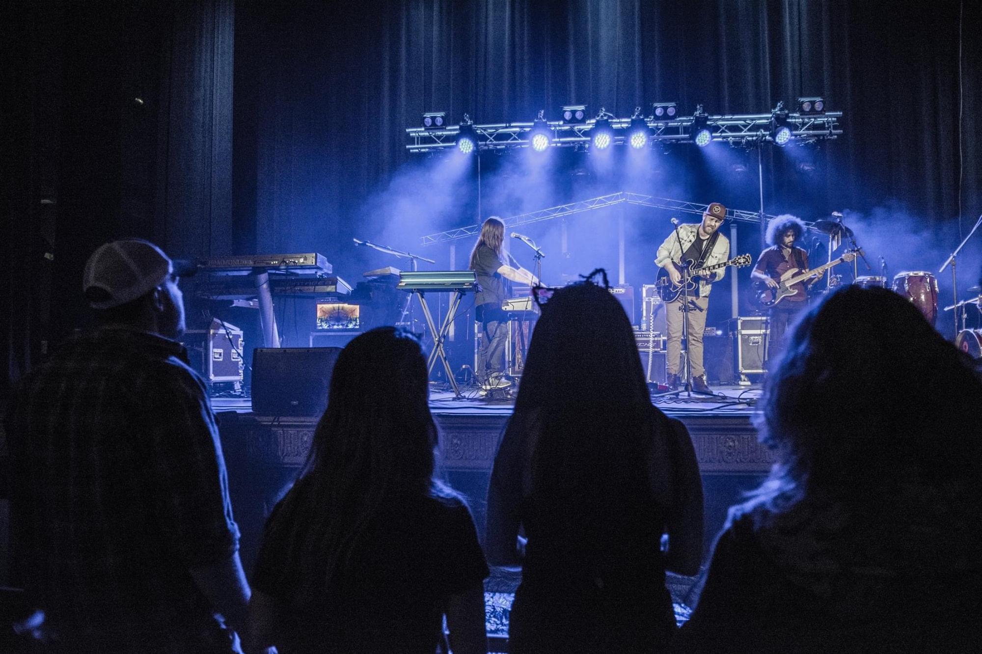 Caitlin is the kitty in the front watching Scott kill it on stage. Photo credit to our dear Jerry Cadieux.