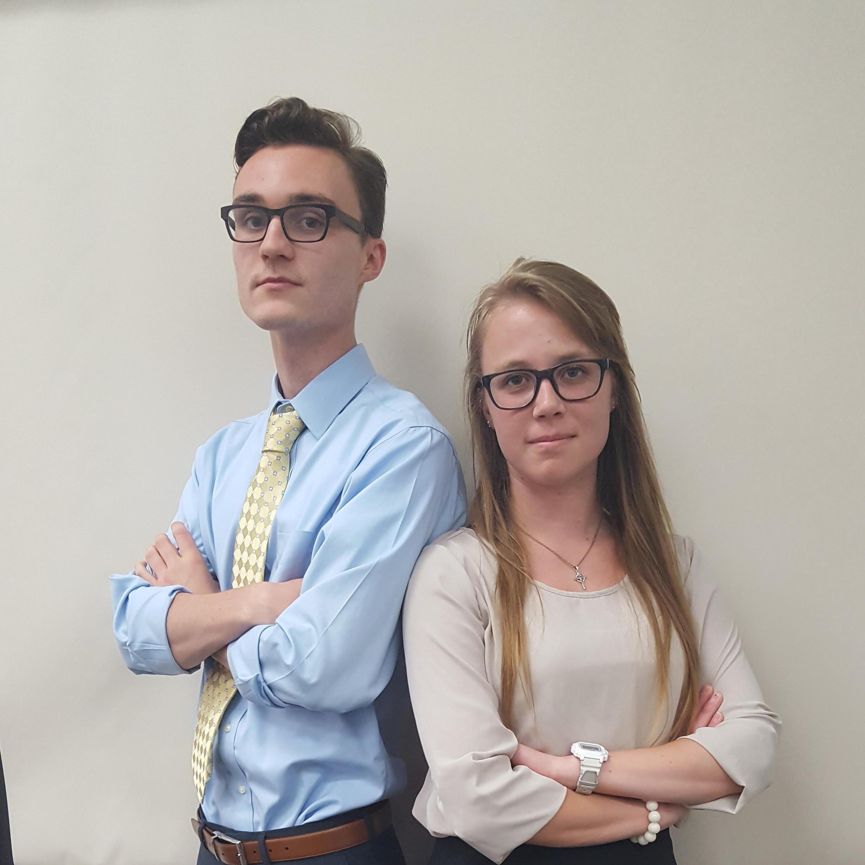 Our first photo together! Taken right after turning in a 60 pg. paper--that's why we look less than pleased!