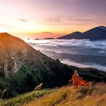 Go on a hiking trail to see a volcano or a waterfall