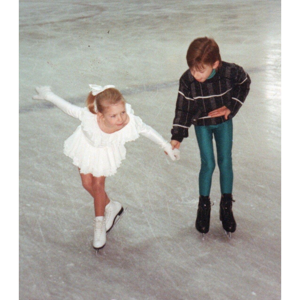 Katie, age 8, ice skating with her brother, Cary.