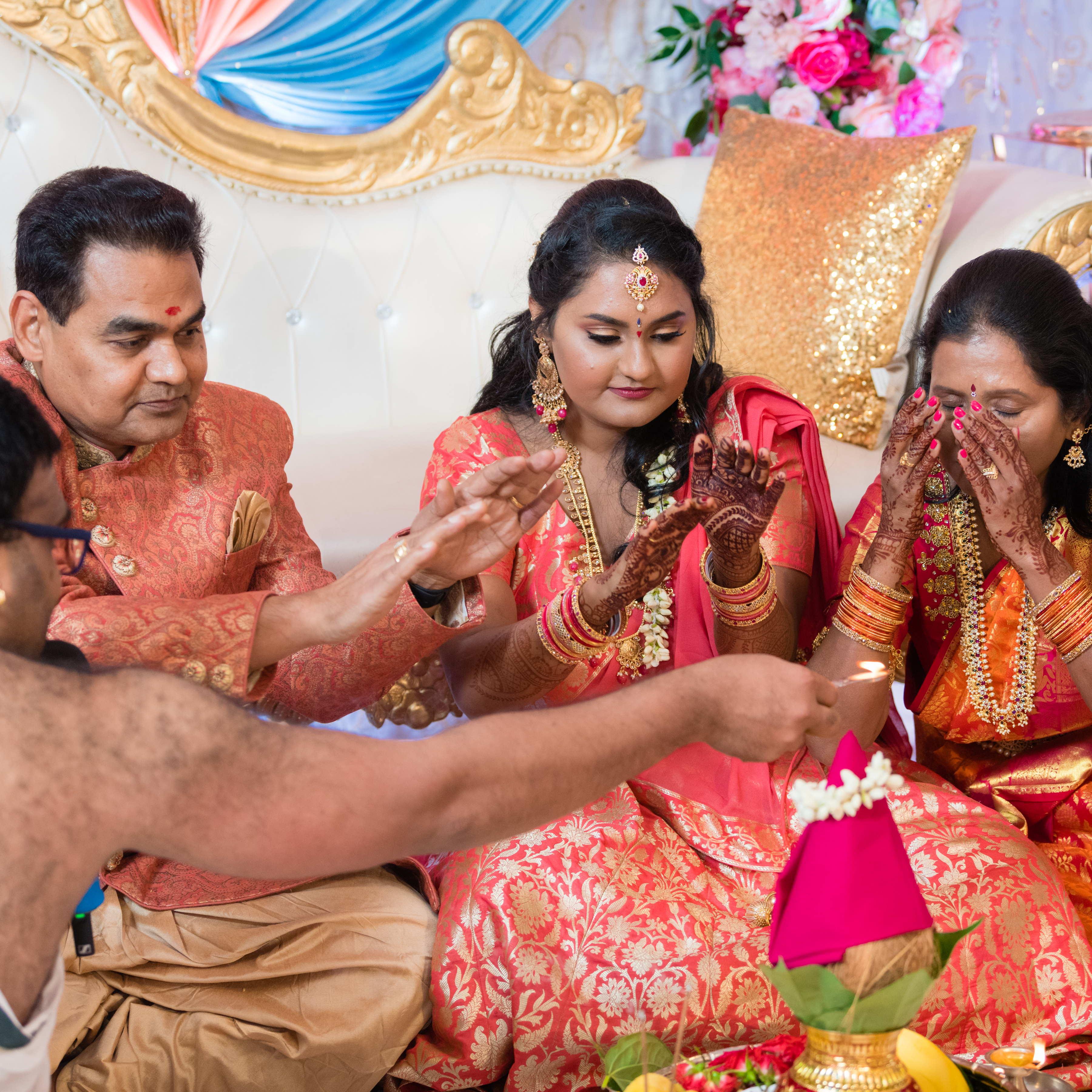 Madhuri's family praying before the engagement