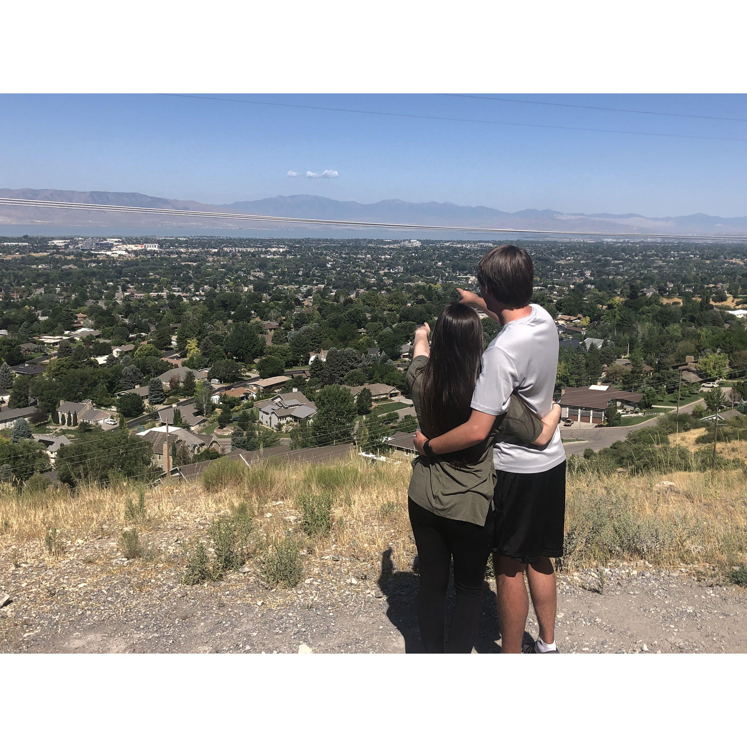 July 21, 2021 - Pointing at our apartment from the view on our hike at Rock Canyon
