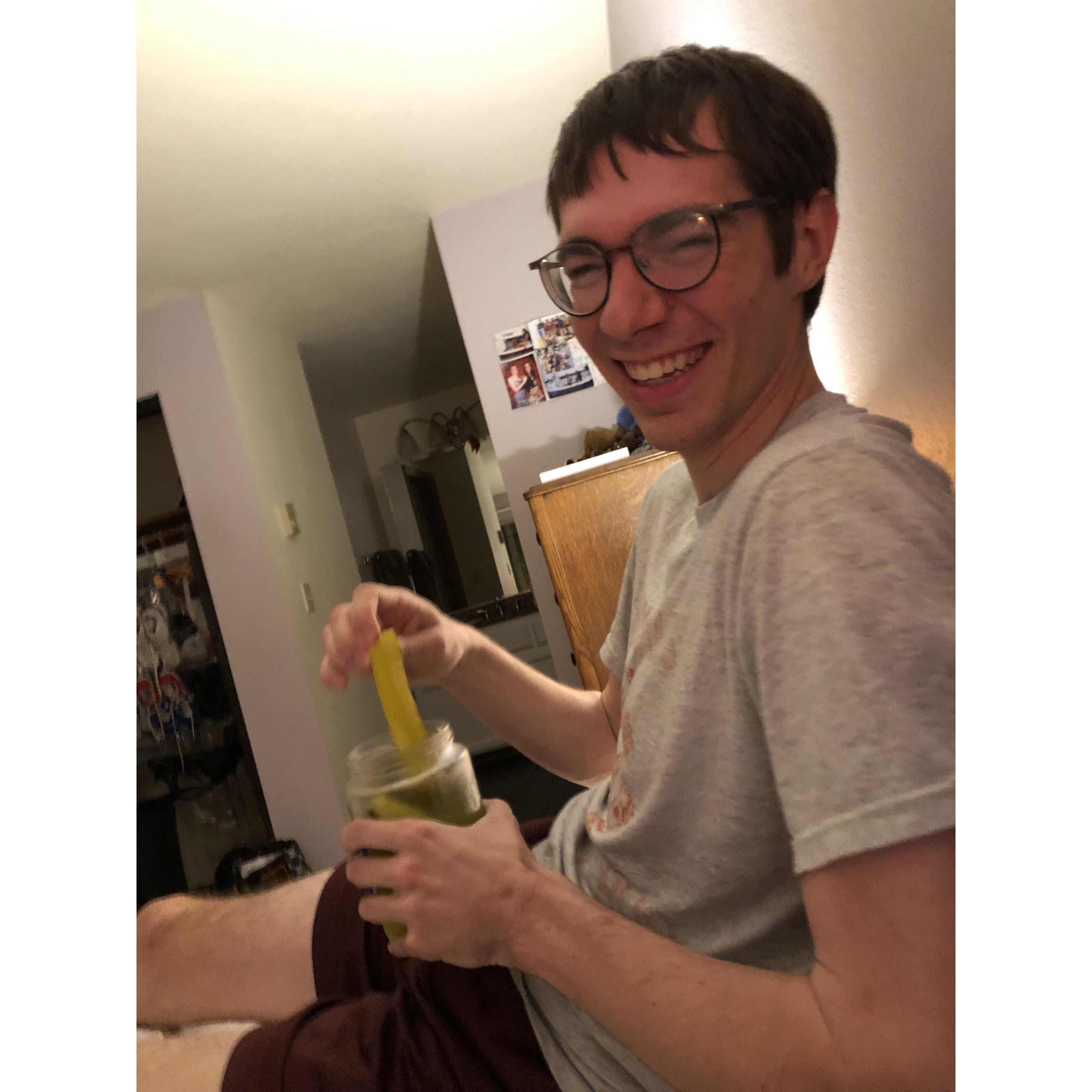 Devin thinking a pickle is a perfectly normal bedtime snack