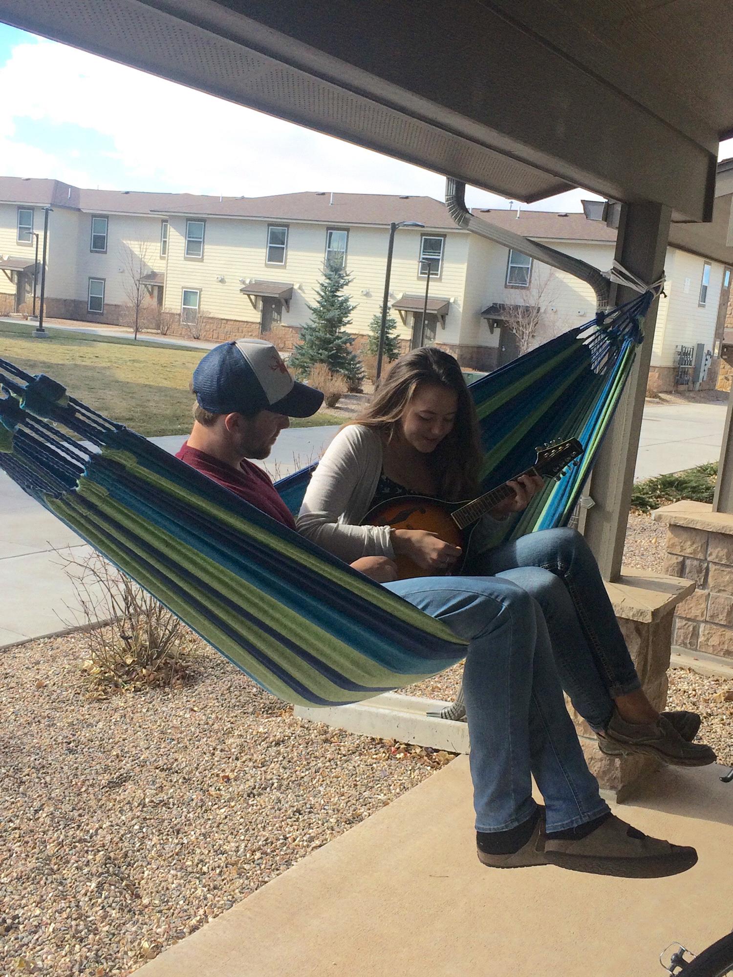 Matt teaching Ryley how to play the ukulele - he is surprisingly good!  She is surprisingly not ;)