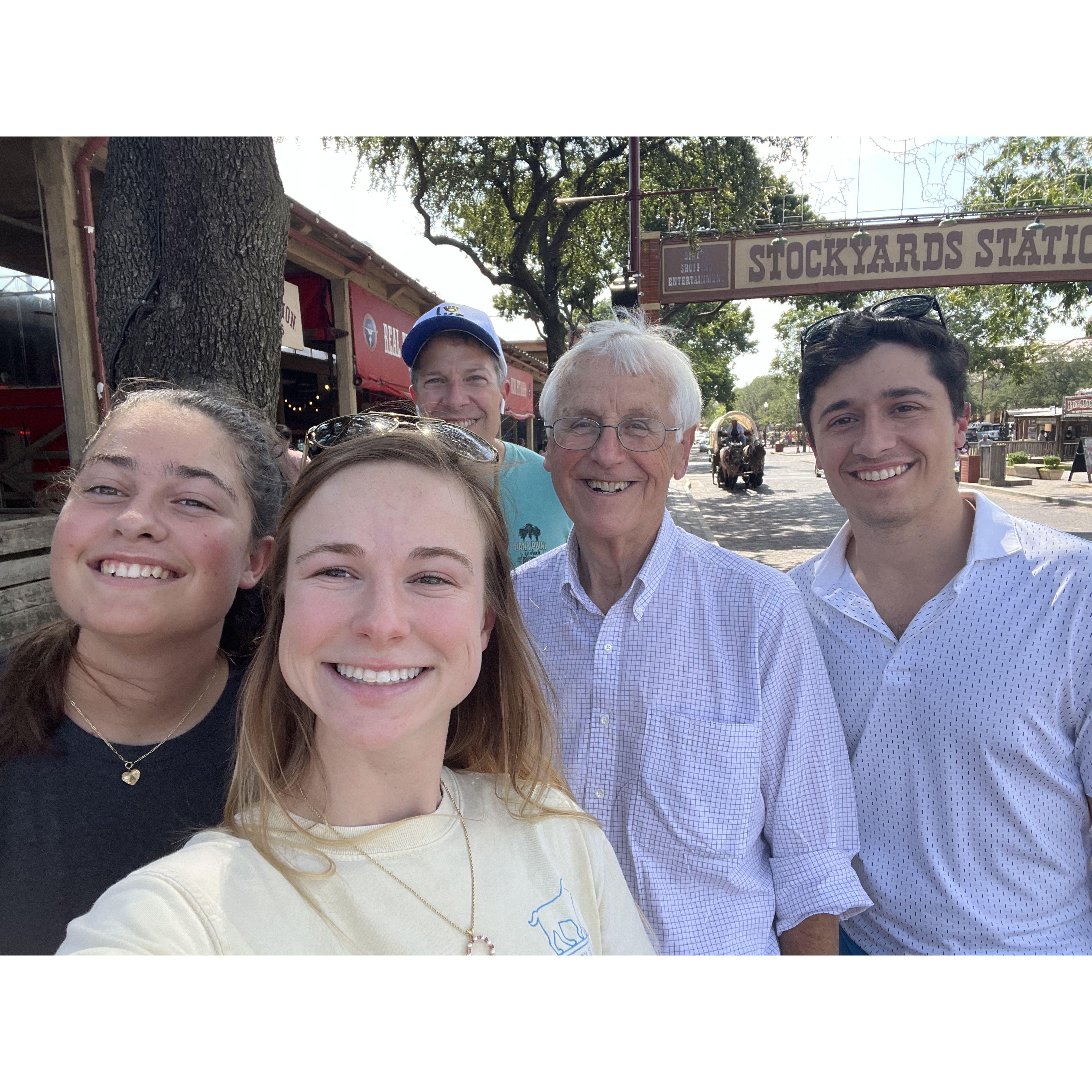 Molly's Uncle Pete (our wedding officiant!) with Michael's dad and sister at the Stockyards