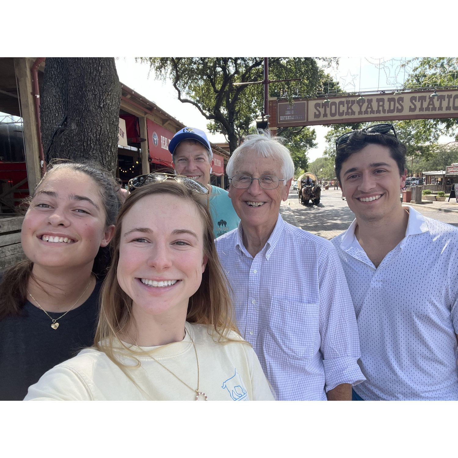 Molly's Uncle Pete (our wedding officiant!) with Michael's dad and sister at the Stockyards