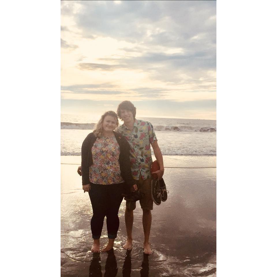 Enjoying a stroll on the beach and watching the sunset in California each for their first time. <3