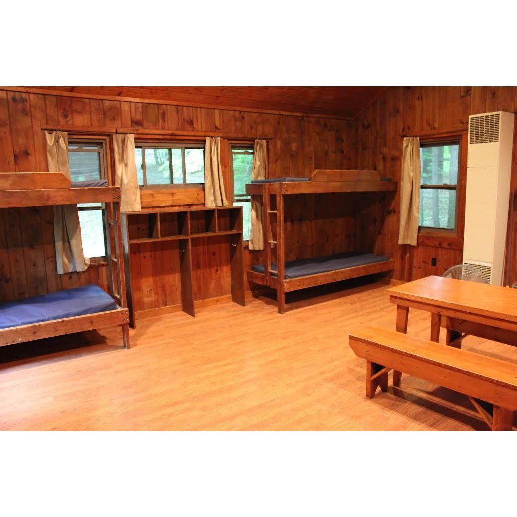 Interior view of the cabins, where you are welcome to stay overnight for $30/cabin. All cabins have a similar interior and fit about eight people. You will need to bring a sleeping bag & pillow.