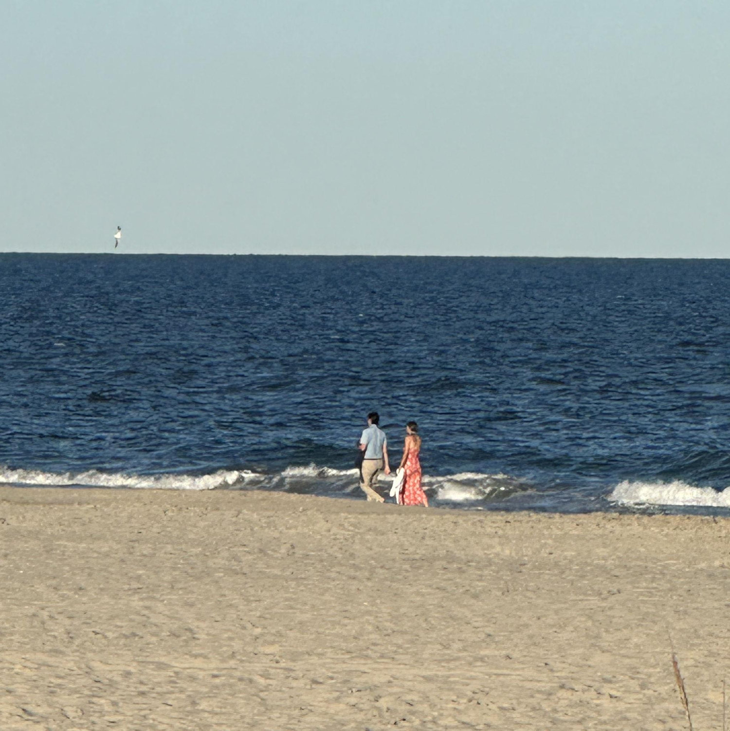 Us walking on the beach just before Reece proposed! Jeff, Lindsay's brother, snuck a couple pictures from afar!