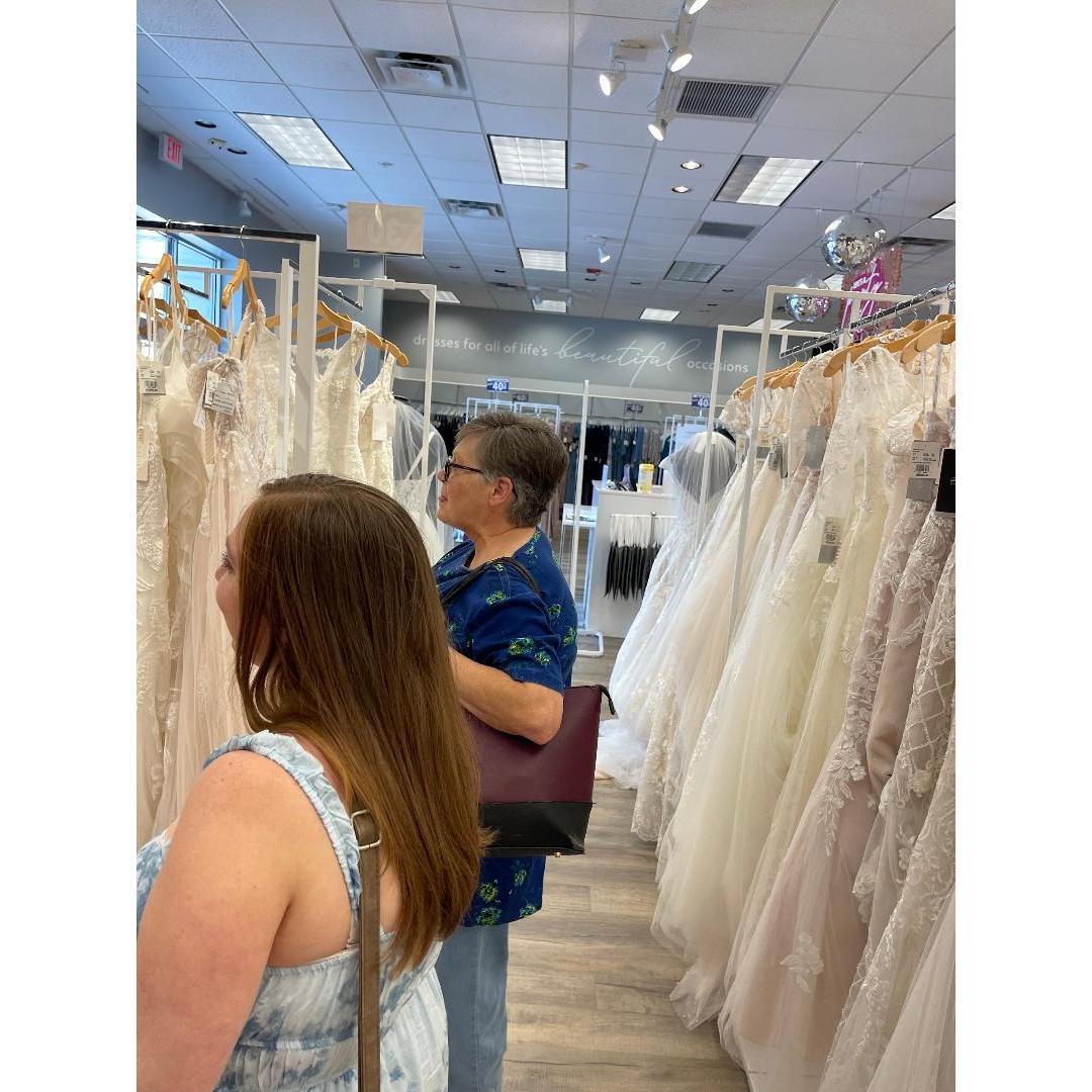 Mom and I focused on searching for the dress, eyes on the prize!