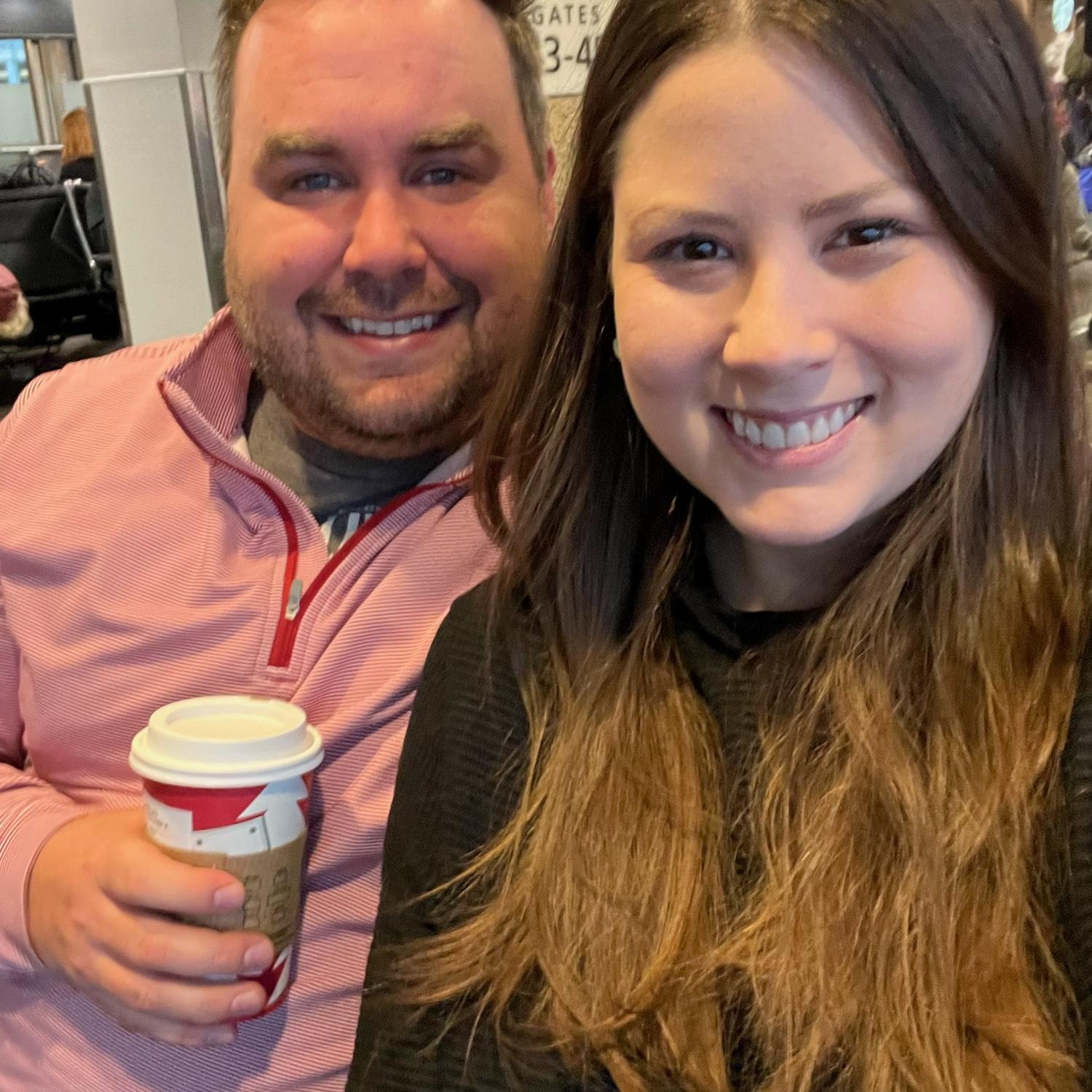 At the airport about to take our first trip together - Chicago 2022