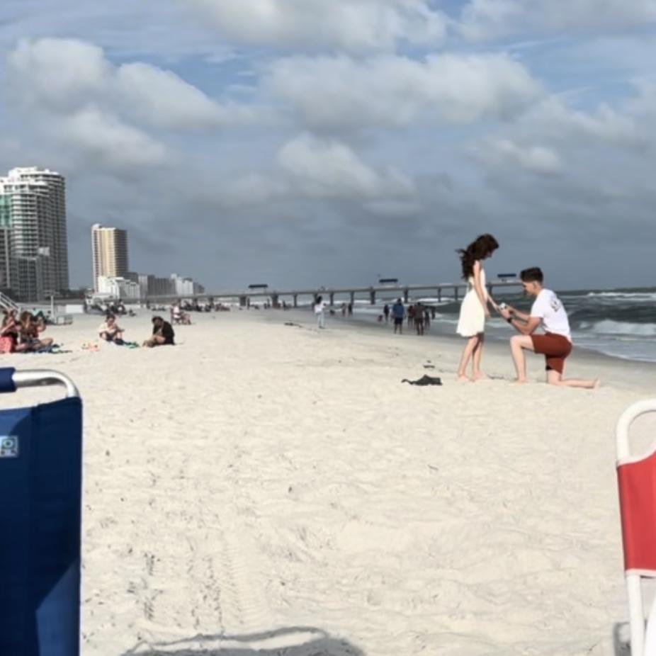 Sam proposing to Ashley at Pensacola Beach Florida.