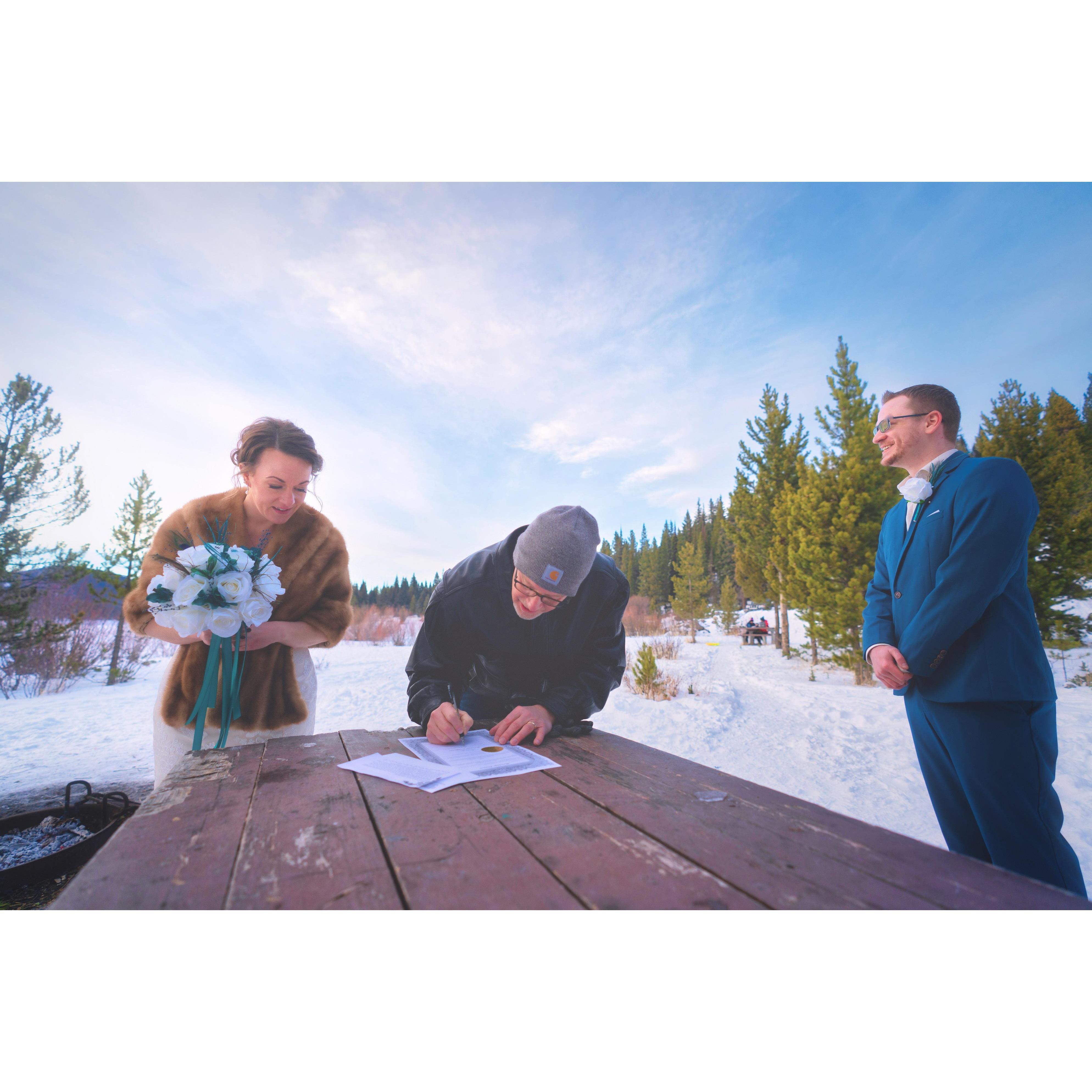 Pastor Brett making it official on the marriage license