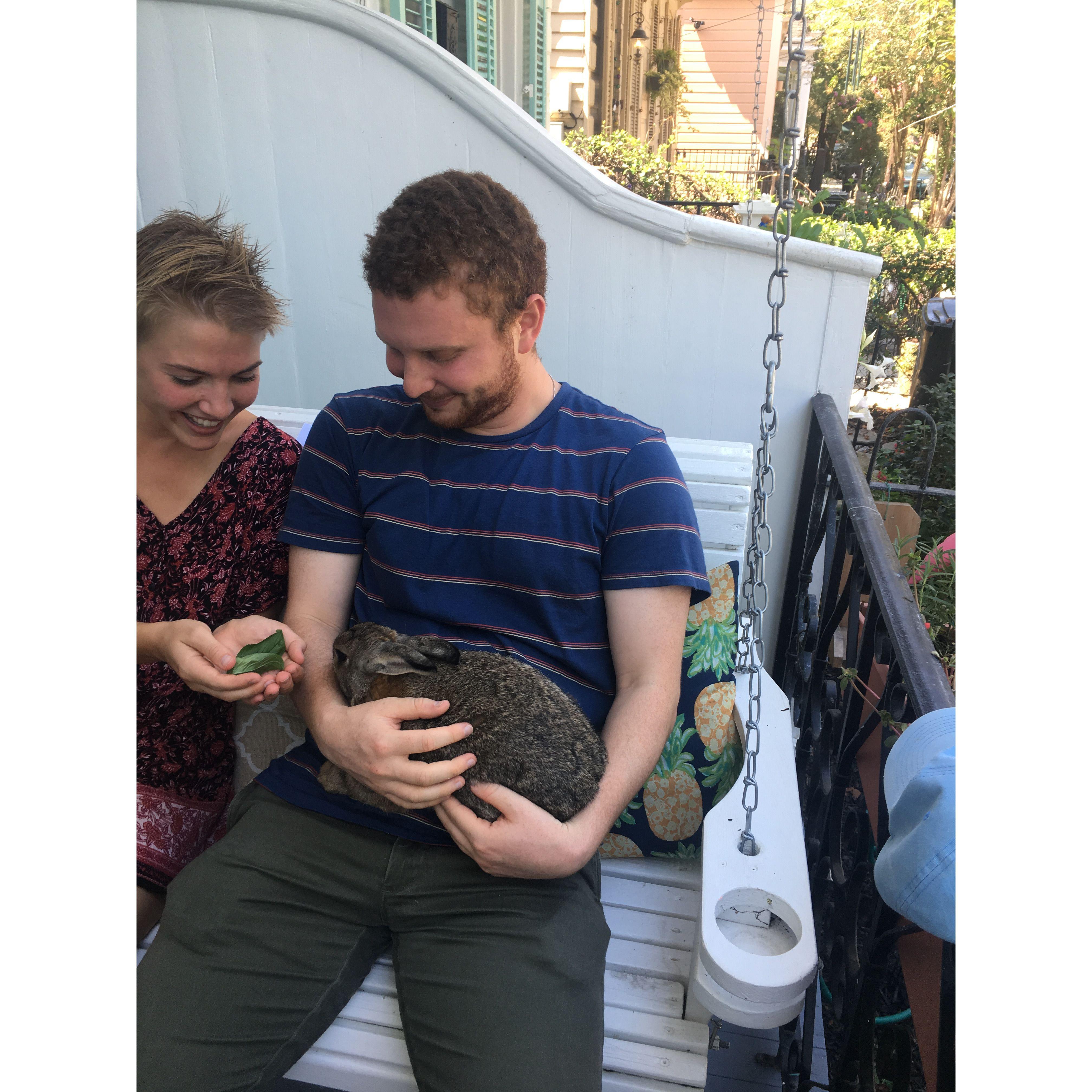 On Amanda and Sam's porch swing in New Orleans, featuring their bunny Pilot