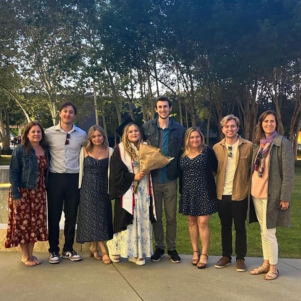 Family, laughter, and a little graduation magic with Johnny by her side.